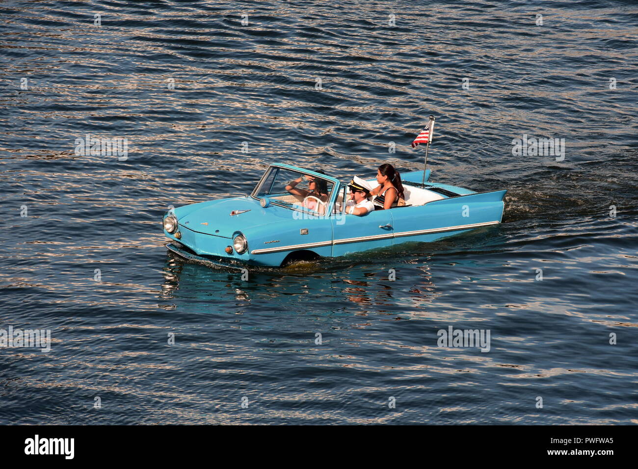 Orlando, Florida; August 24, 2018 Water Taxi , Blue Vintage Car, Funny