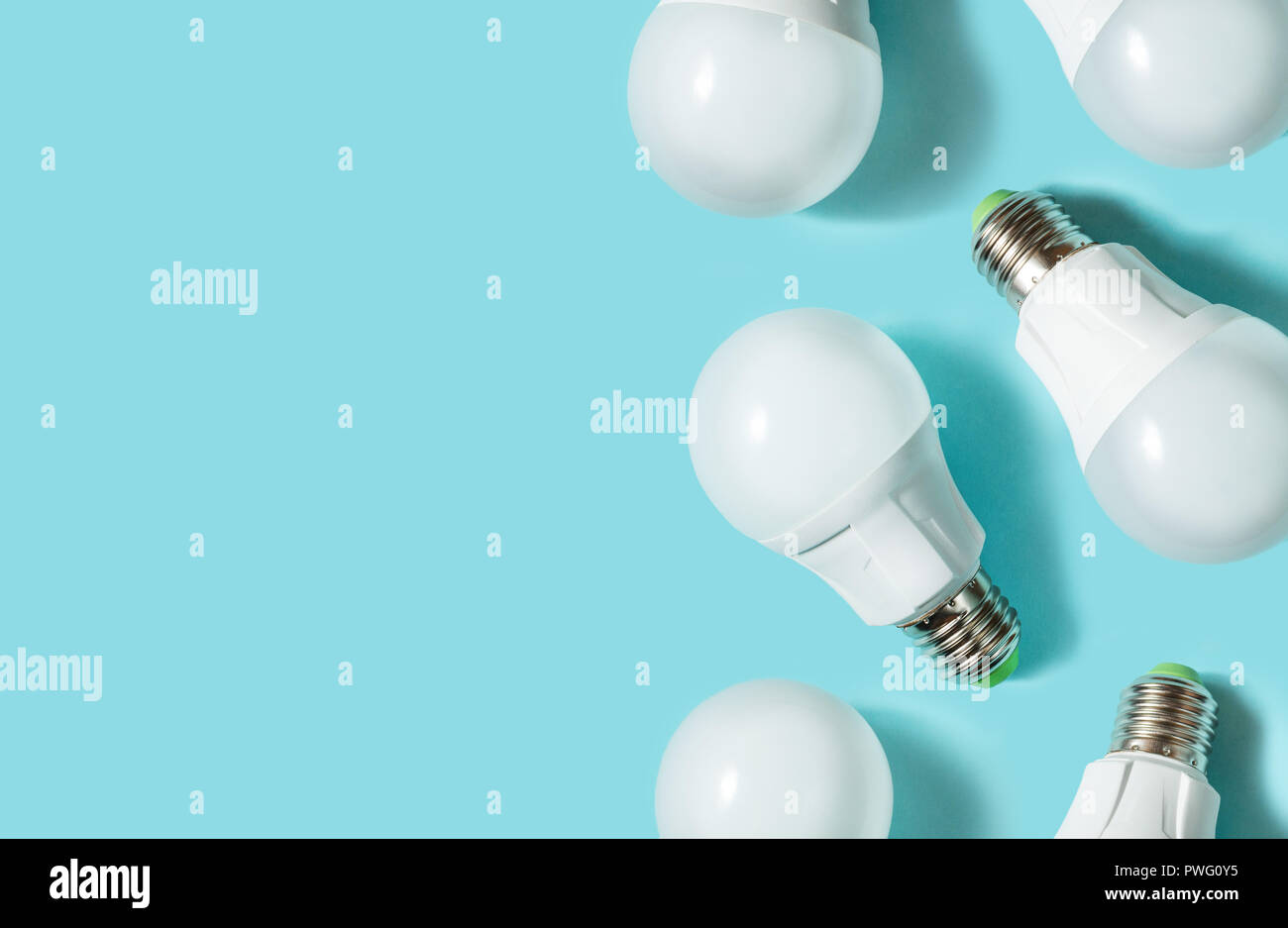 LED light bulbs on blue color background. Flat lay. Pattern. Copy space Stock Photo