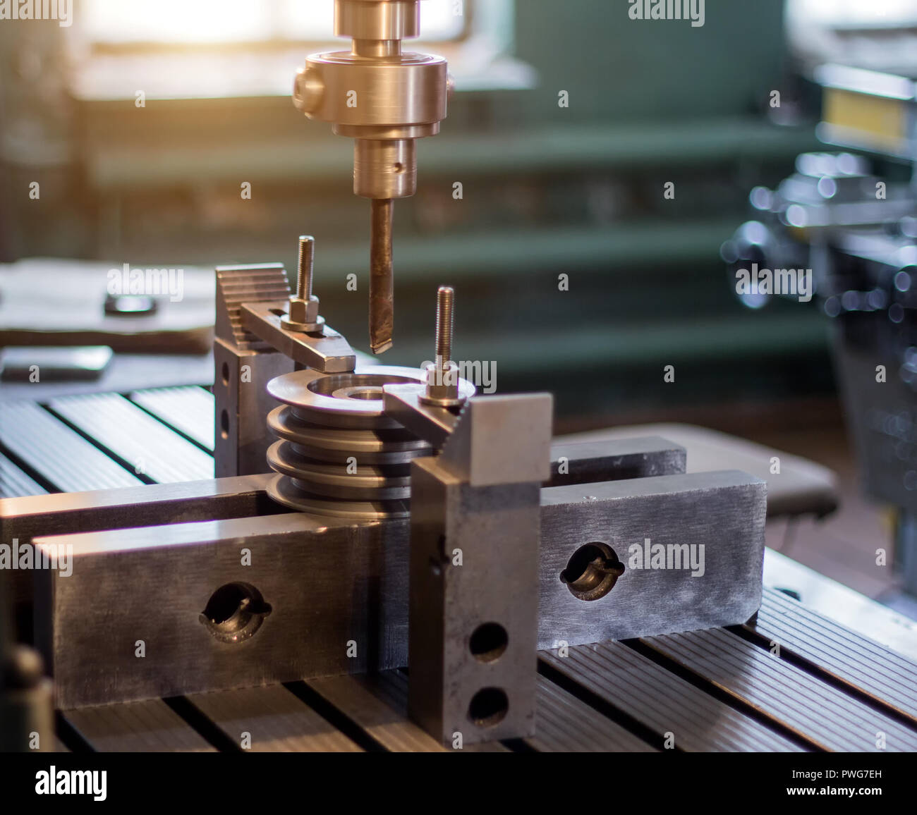 The man specialist checks the measuring tool with the size of drilling
