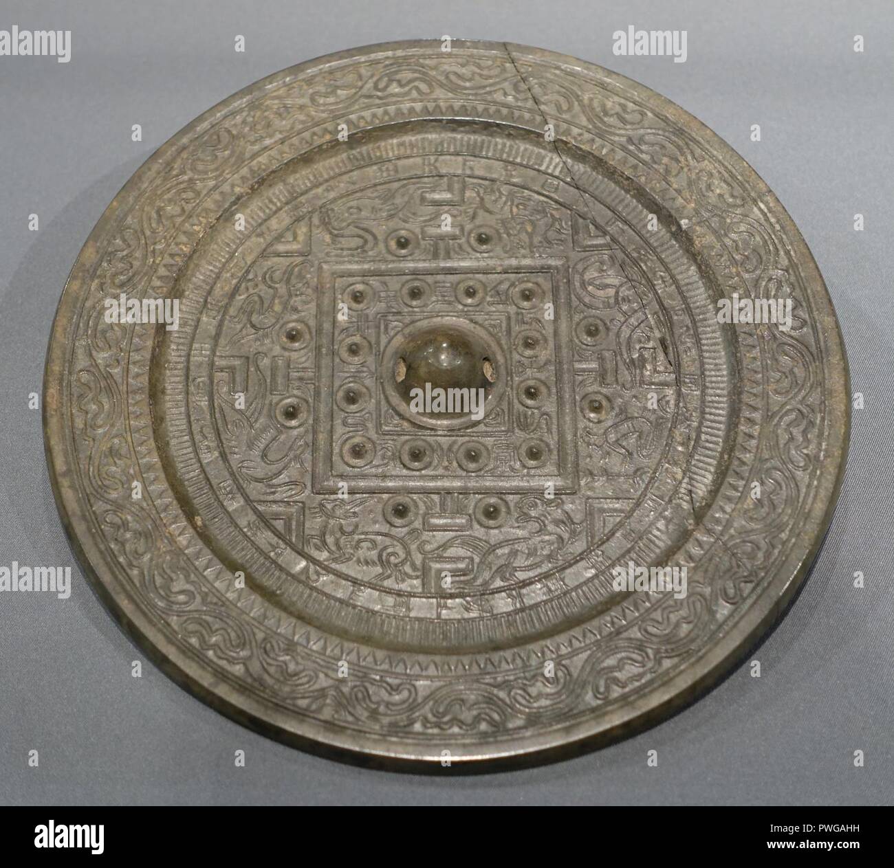 Bronze mirror with LTV pattern and four deities motifs, Eastern Han  dynasty, from M1 at the construction site of No. 65, Meihua Cun, Guangzhou  Stock Photo - Alamy