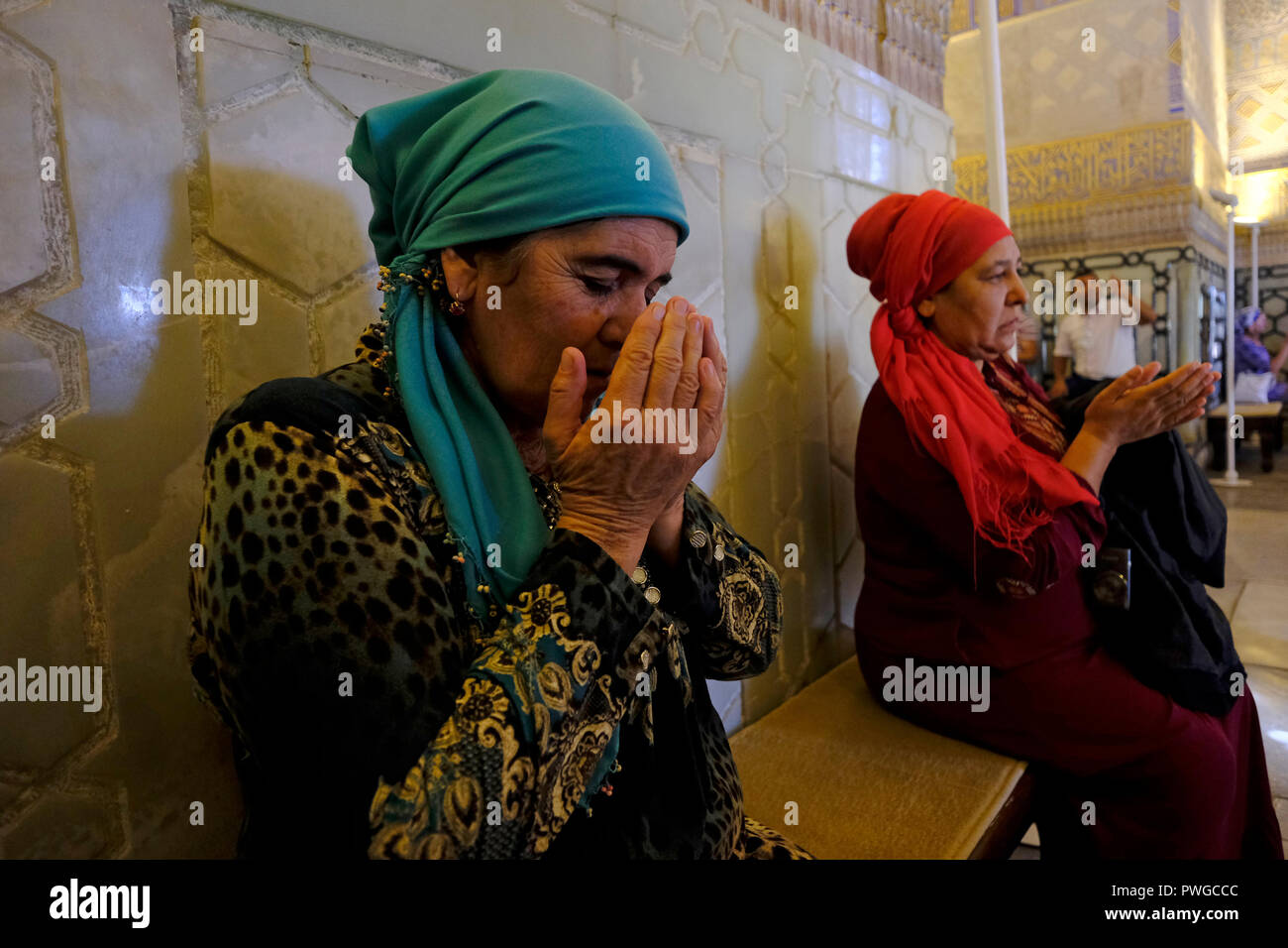 Uzbek Muslim women praying inside Gur-i Amir or Guri Amir mausoleum of the  Turco-Mongol conqueror Timur also known as Tamerlane in the city of  Samarkand alternatively Samarqand in Uzbekistan Stock Photo 