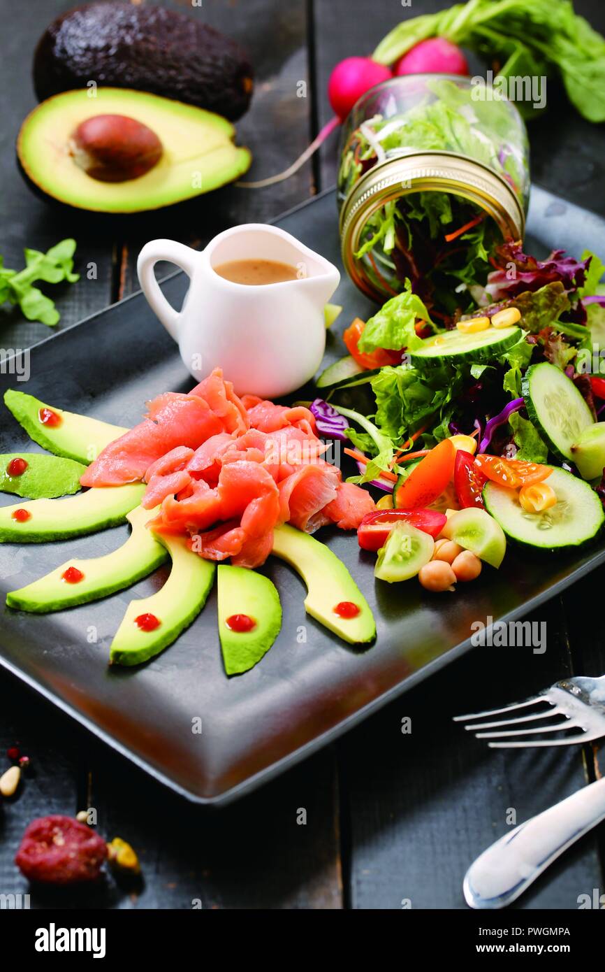 Smoked salmon with avocado salad Stock Photo - Alamy