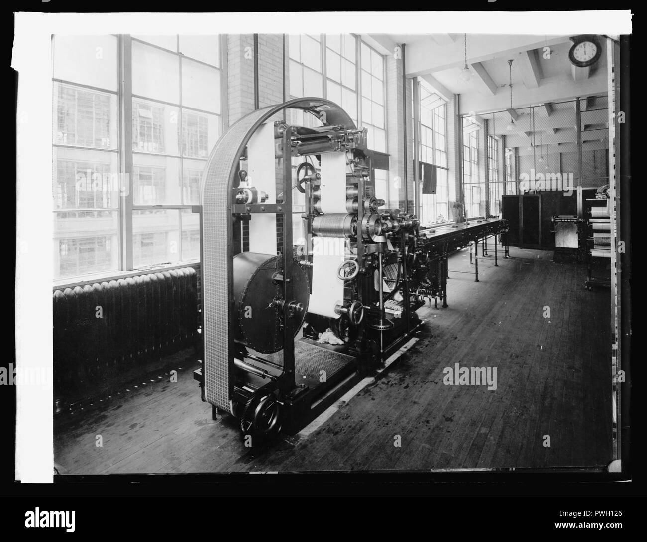 Bureau Eng. & Ptg. Intaglio Web Press prints, (.),drives, preforates & completes postage stamps, (1914) Stock Photo