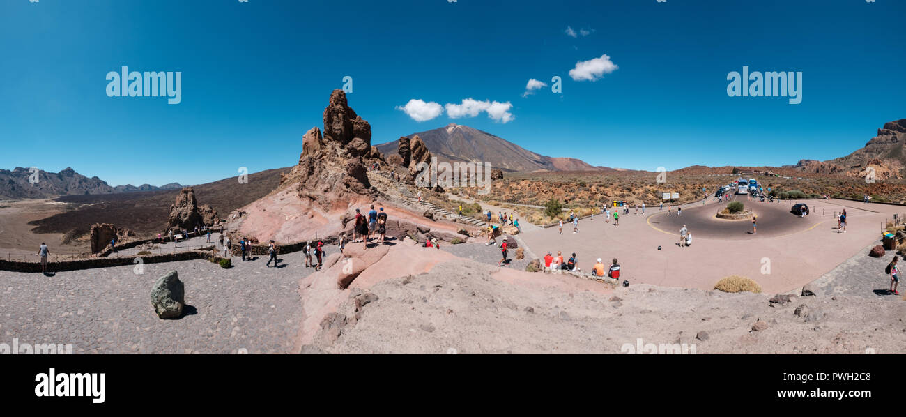Tenerife, Canary Islands, Spain - September 2018: Tourists at Roque Cinchado rock on Mount Teide (Pico delTeide) National Park, Tenerife Spain Stock Photo