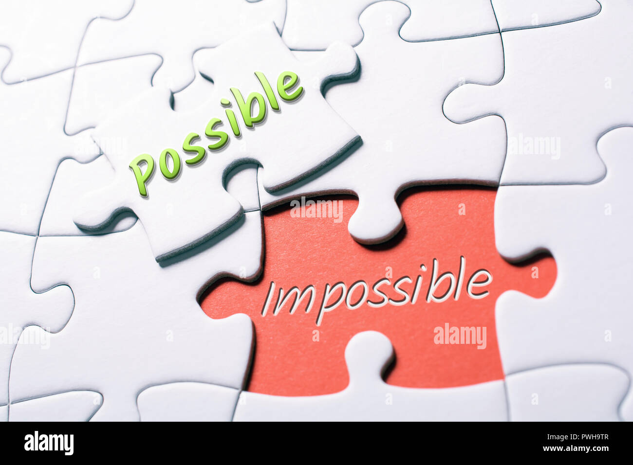 The Words Possible And Impossible In Missing Piece Jigsaw Puzzle Stock Photo