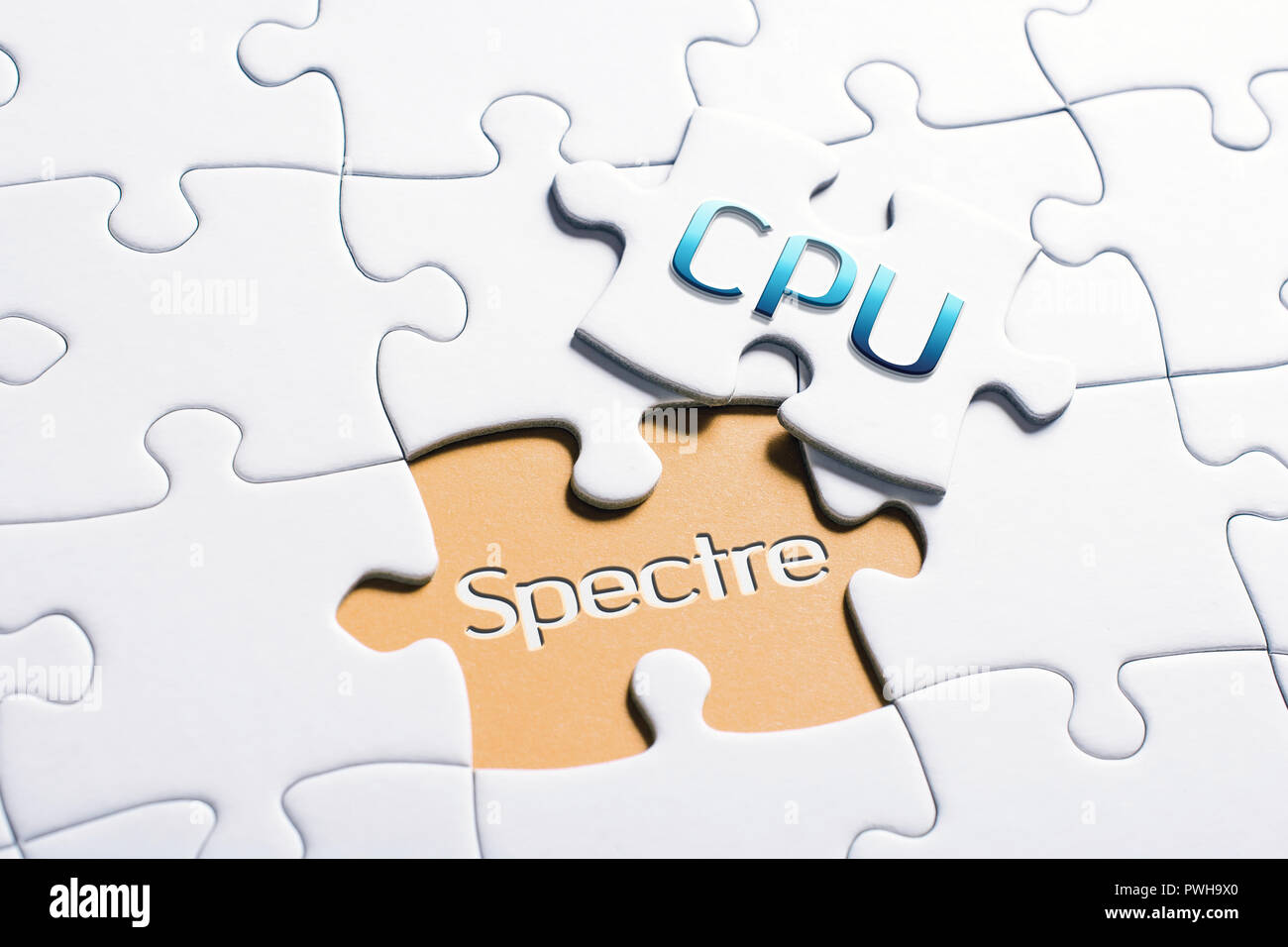 The Words CPU And Spectre In Missing Piece Jigsaw Puzzle Stock Photo