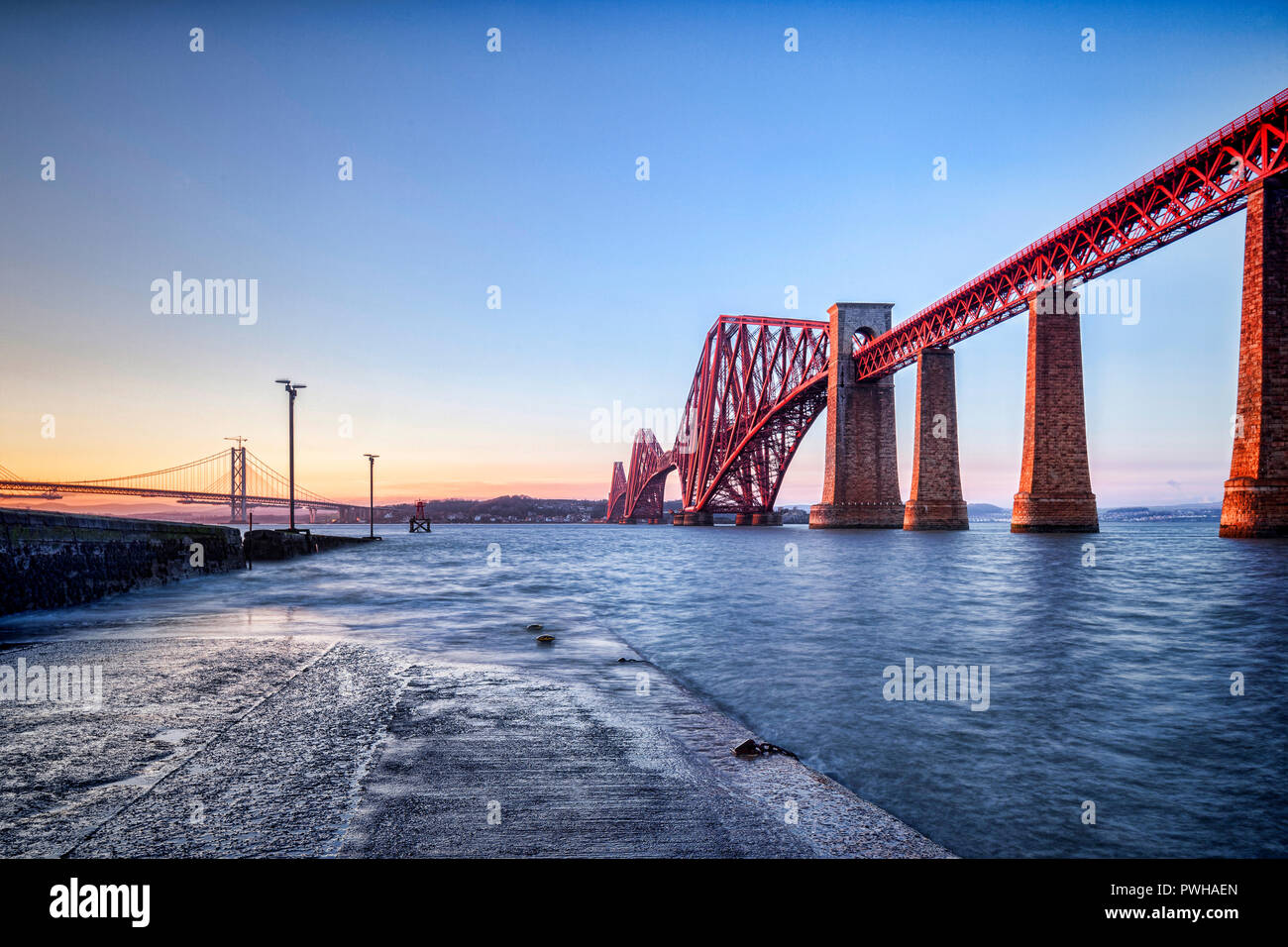 Forth Rail bridge, Queensferry, Edinburgh, East Lothian, Scotland, UK, one of the most famous bridges in the world and an icon of Scotland, at sunset. Stock Photo