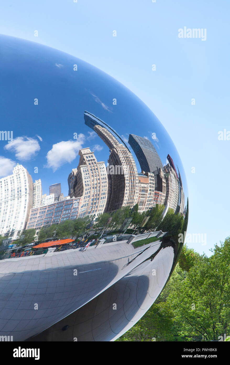 Downtown buildings reflected in the mirror surface of The Bean sculpture in Millennium Park in Chicago, Illinois. Stock Photo
