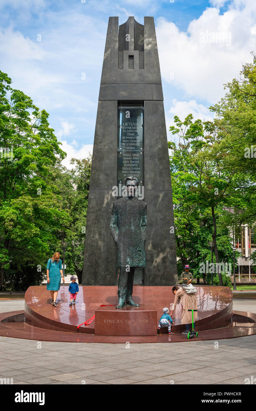 Lithuania people, view of mothers and their children visiting a monument in Vilnius dedicated to hero and national anthem composer Vincas Kudirka. Stock Photo