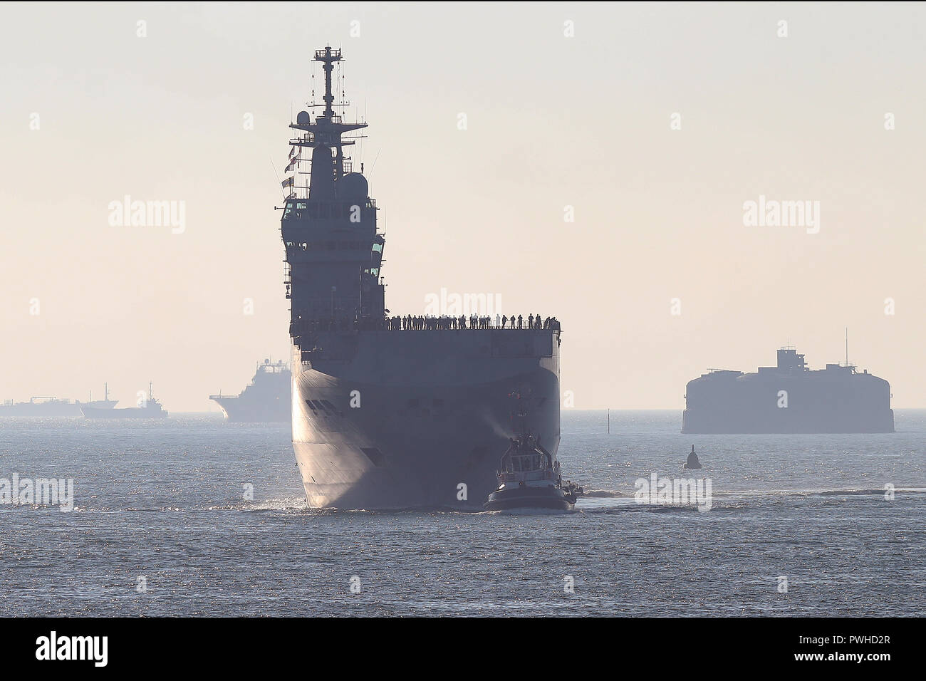 The French Navy amphibious assault ship and helicopter carrier, FS Dixmude, arrives into Portsmouth harbour. Stock Photo