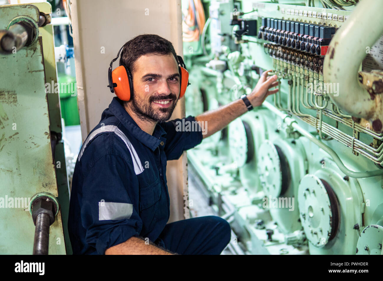 Marine Engineer Officer Working In Engine Room Stock Photo - Alamy