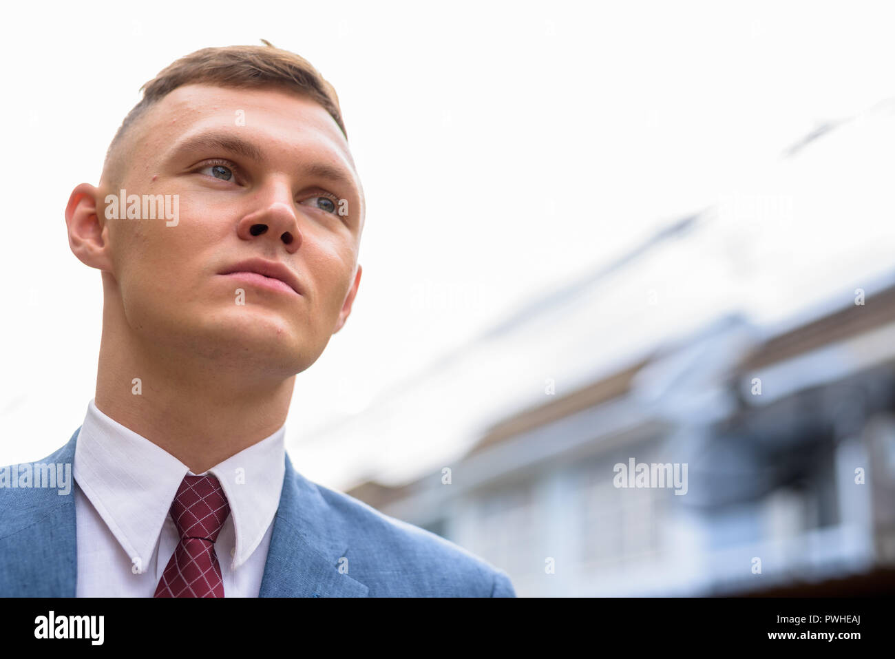 Portrait of young businessman in the streets outdoors Stock Photo