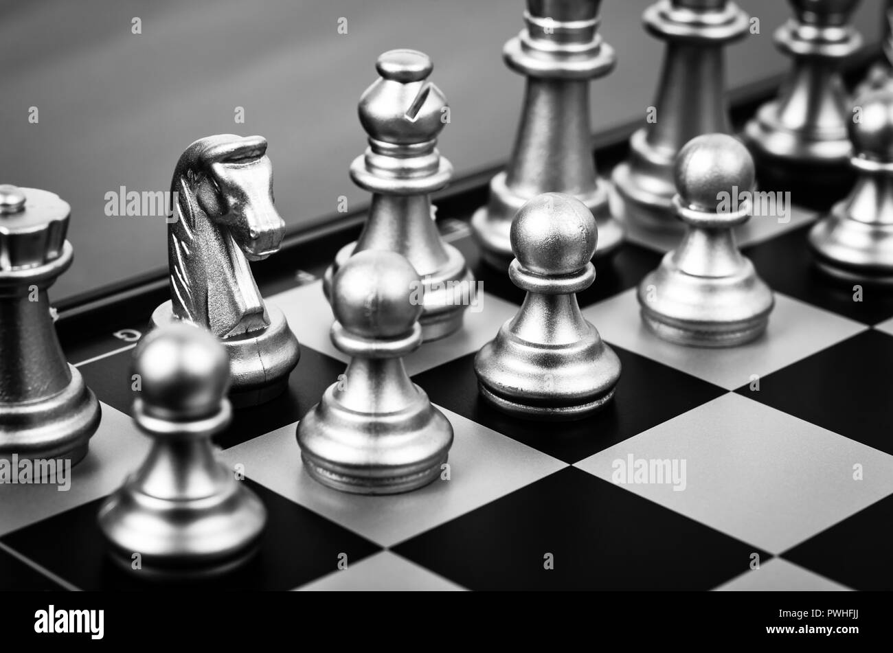 chess pieces on a black and white chess board. Stock Photo