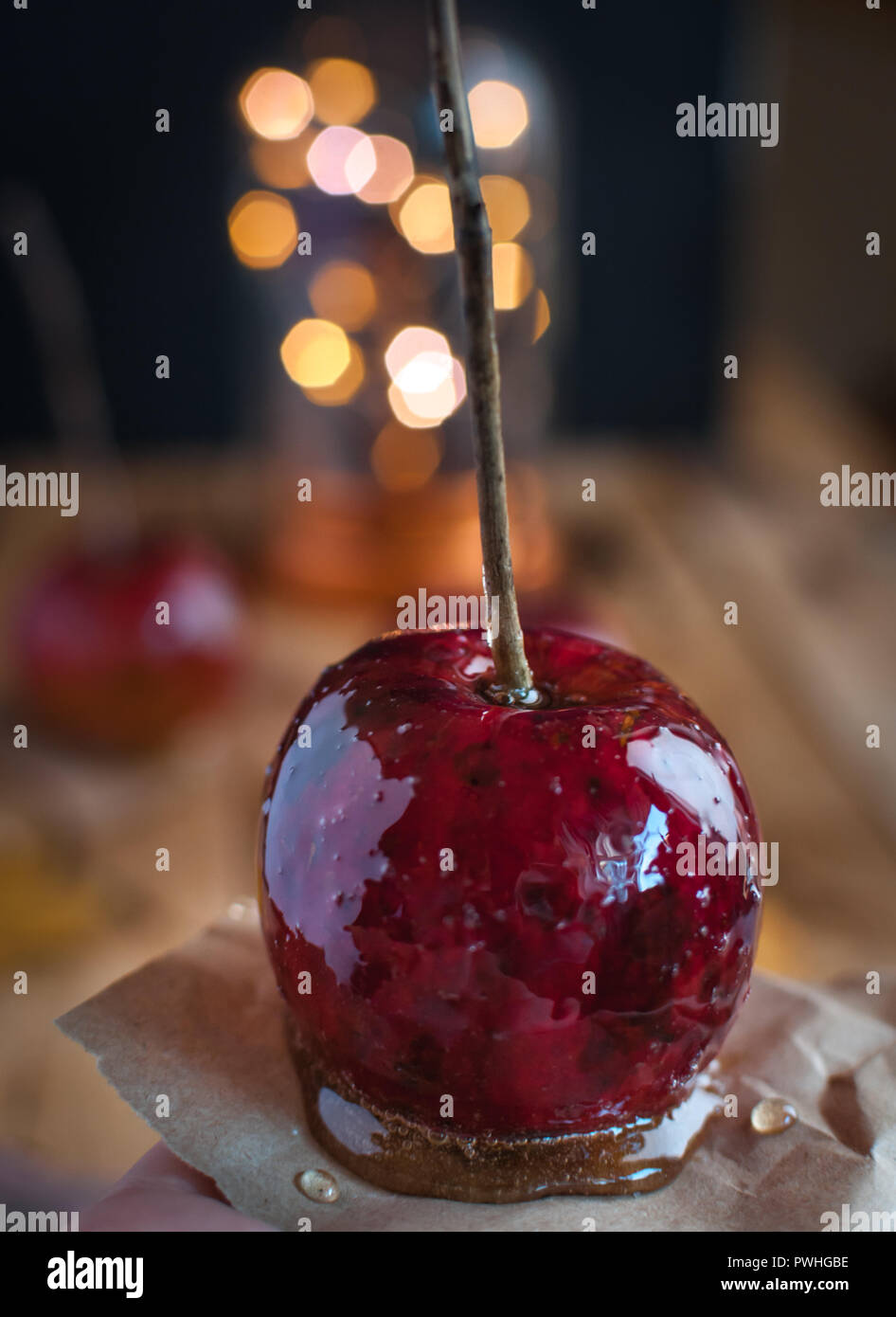 Close-up of candy apple on wooden background Stock Photo