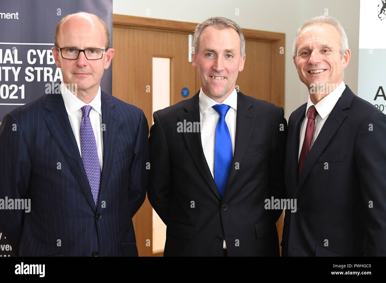 (left to right) GCHQ director Jeremy Fleming, Ciaran Martin, head of the National Cyber Security Centre (NCSC), and Cabinet Office minister David Lidington at the launch of the centre's second annual review in London. Stock Photo