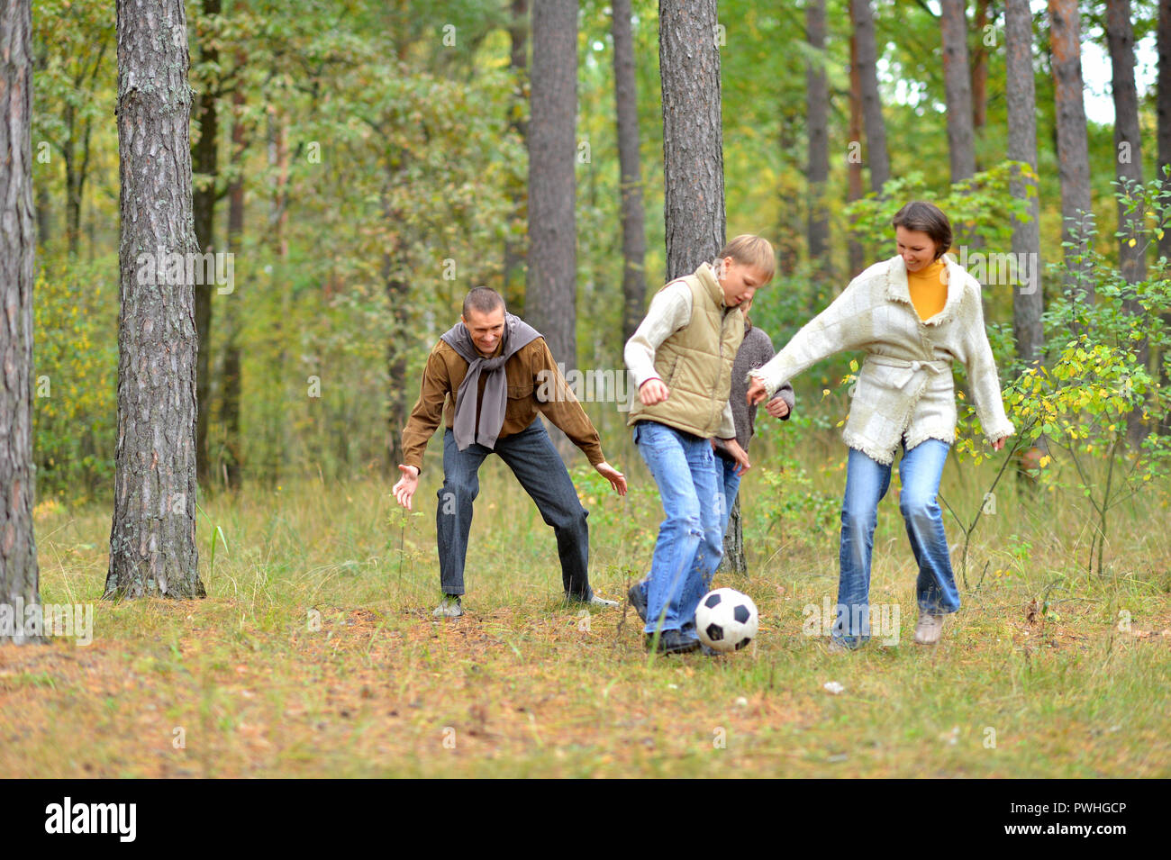Portrait of big happy family playing football in park Stock Photo - Alamy