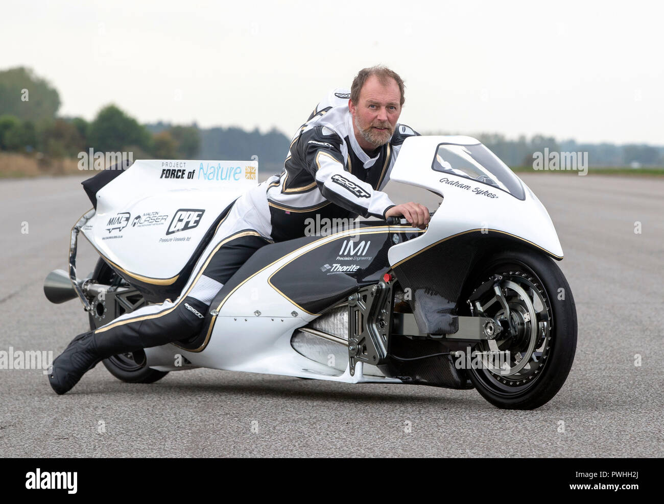 Graham Sykes on his 'Force of Nature' steam rocket bike ahead of tow testing his bike in preparation for his world land speed record attempt for a steam powered vehicle, during the Straightliners top speed &amp; wheelie event at Elvington Airfield in Yorkshire. Stock Photo