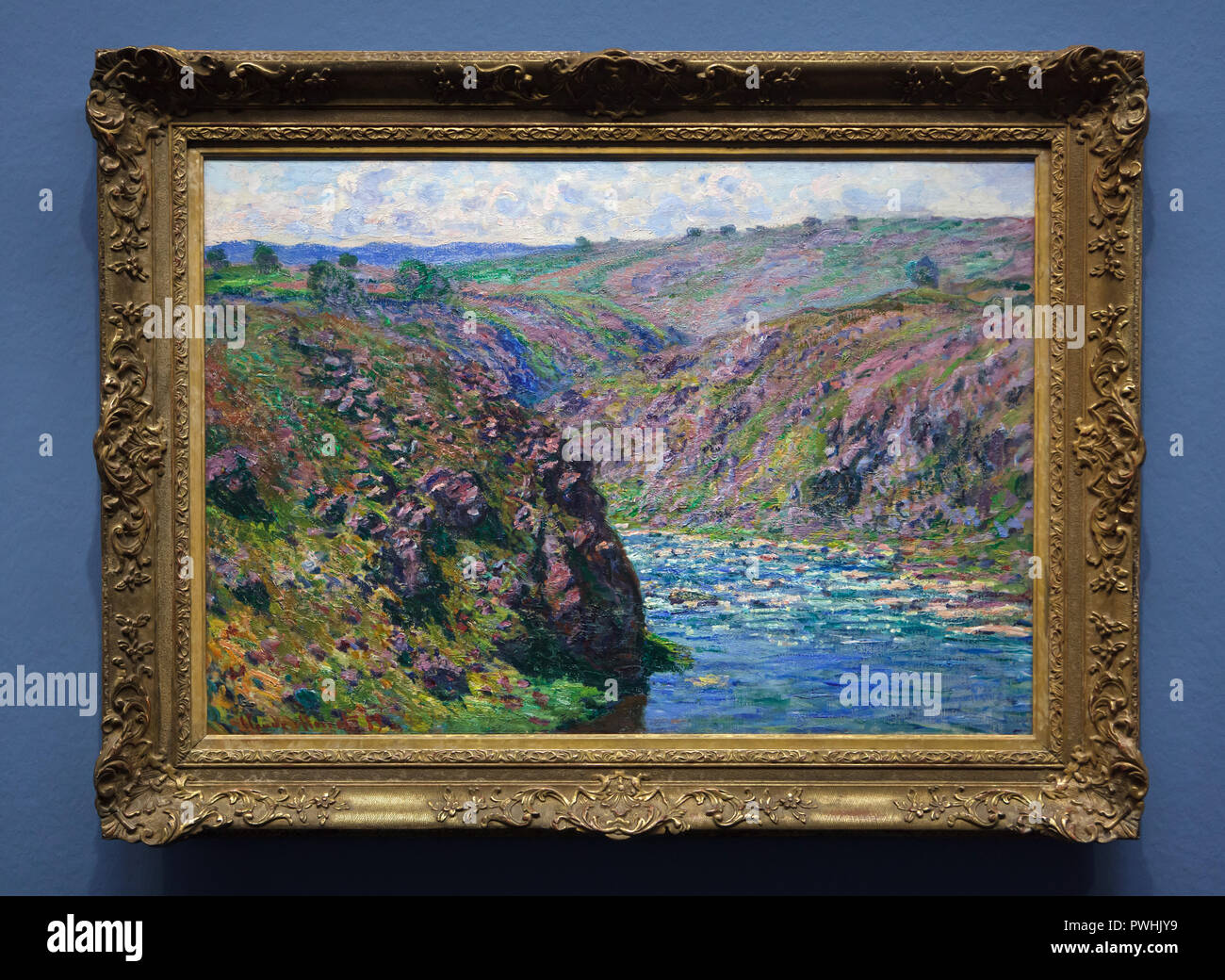 Painting 'Valley of the Creuse, Sunlight Effect' (1889) by French Impressionist painter Claude Monet on display at his retrospective exhibition in the Albertina Museum in Vienna, Austria. The exhibition devoted to the founder of French Impressionist painting runs till 6 January 2019. Stock Photo