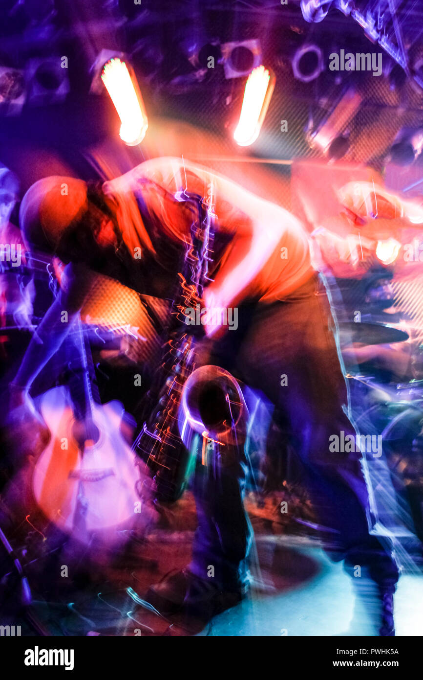 Musician with Sax photographed with an explosive effect of lights and motion Stock Photo