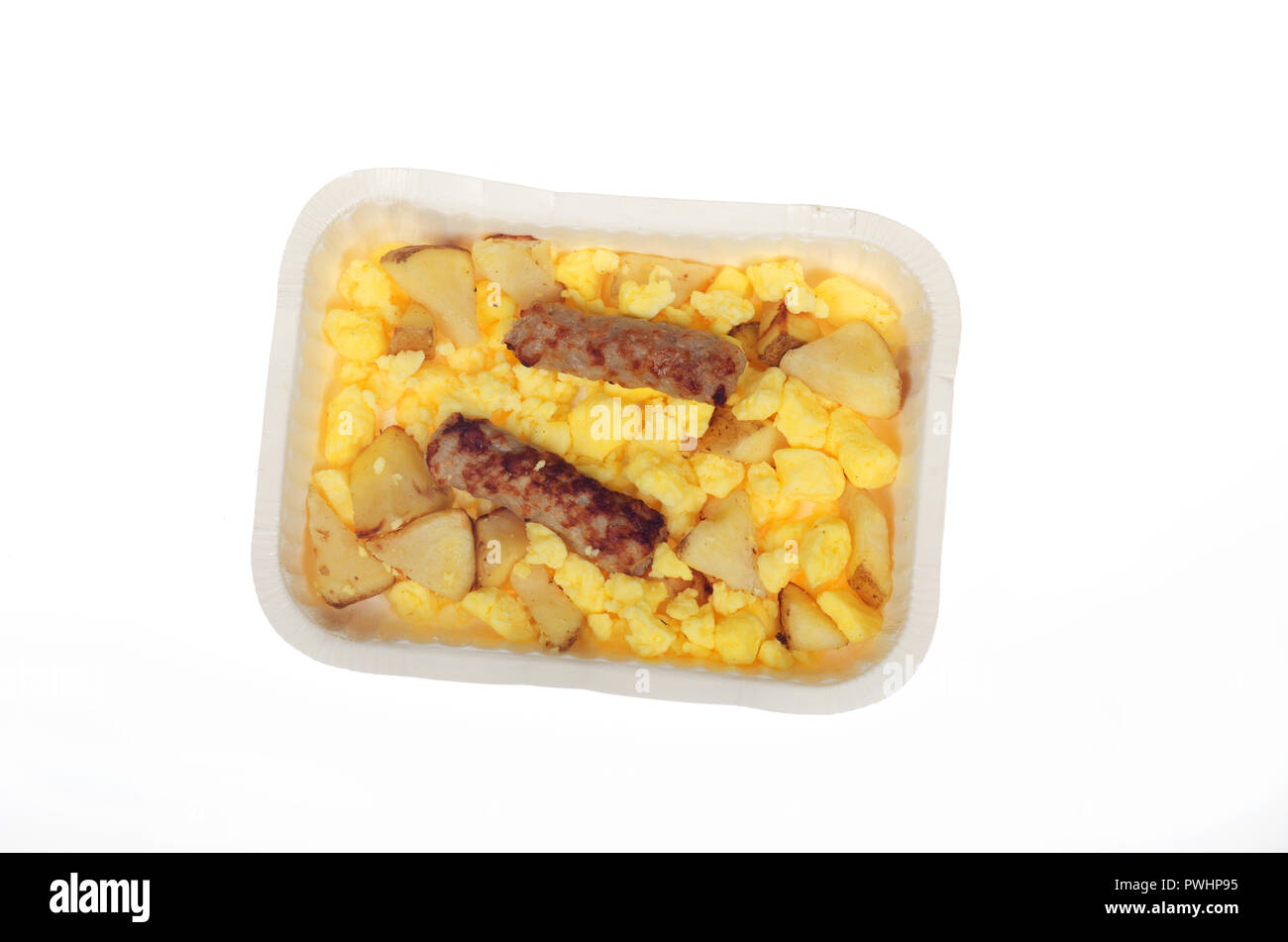 Hot cooked from frozen Aunt Jemima scrambled eggs with roasted potatoes and sausage links in tray on white Stock Photo