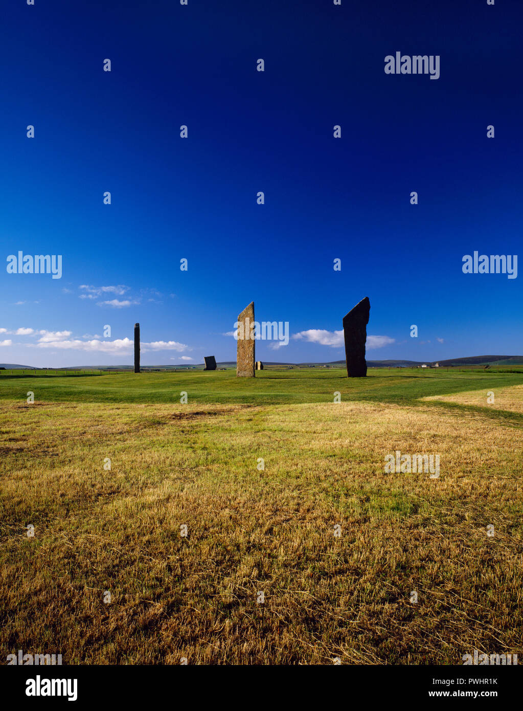 View NNE showing the Stones of Stenness stone circle, Orkney, Scotland, UK, standing within the remains of a circular earthwork henge monument. Stock Photo