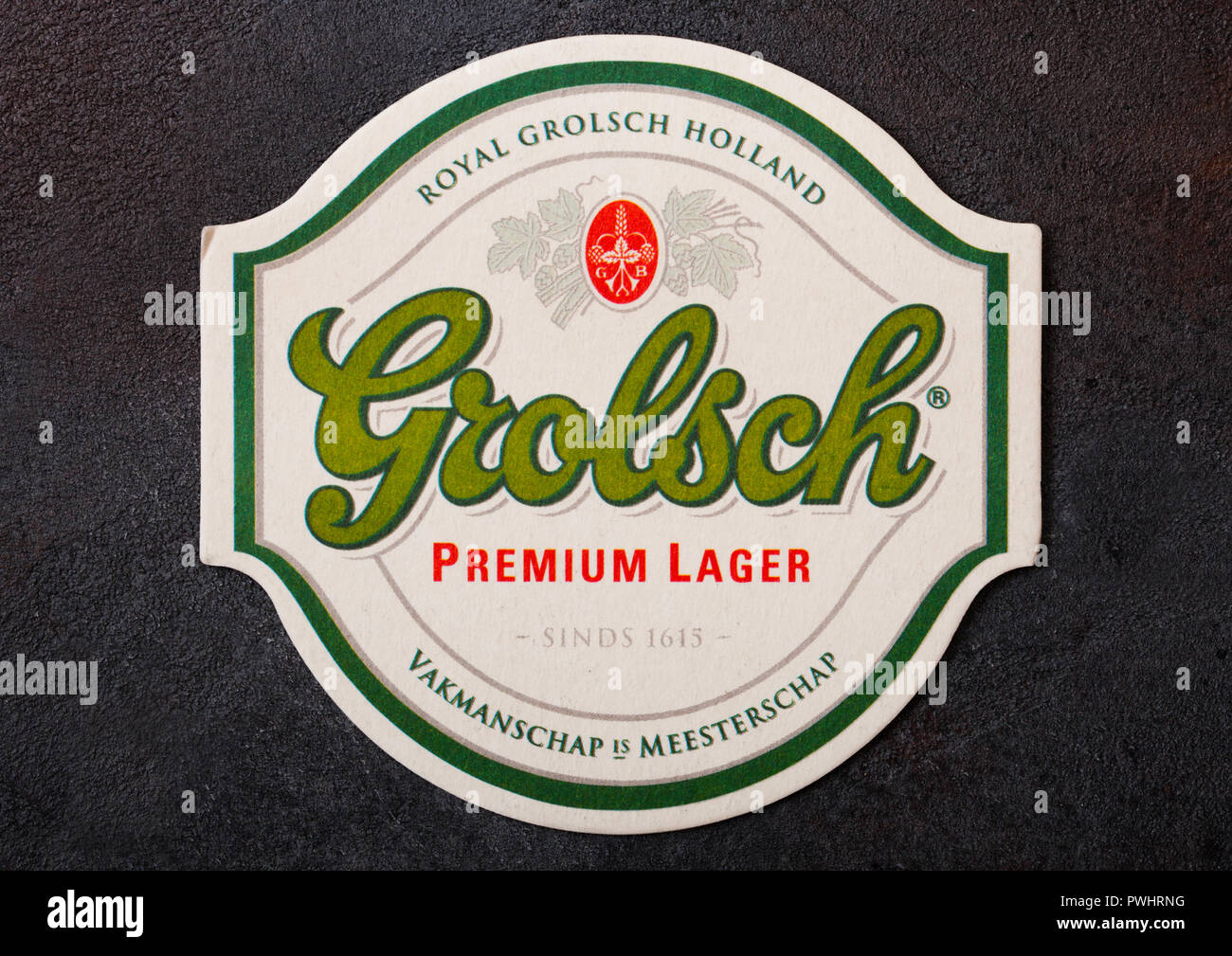 LONDON, UK - AUGUST 22, 2018: Grolsch lager paper beer beermat coaster on black background. Stock Photo