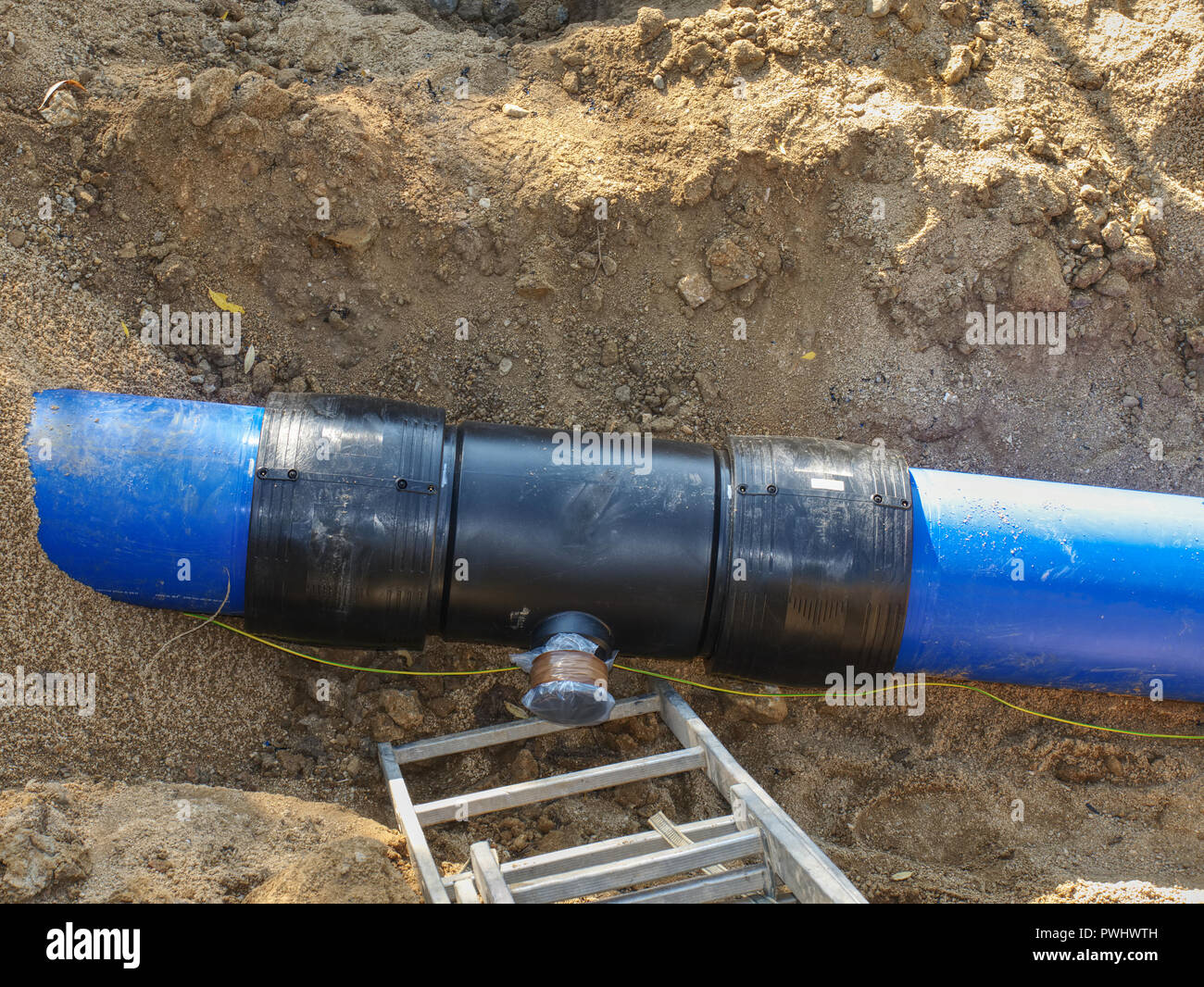Repairing process of underground water supply pipeline. Blue plastic