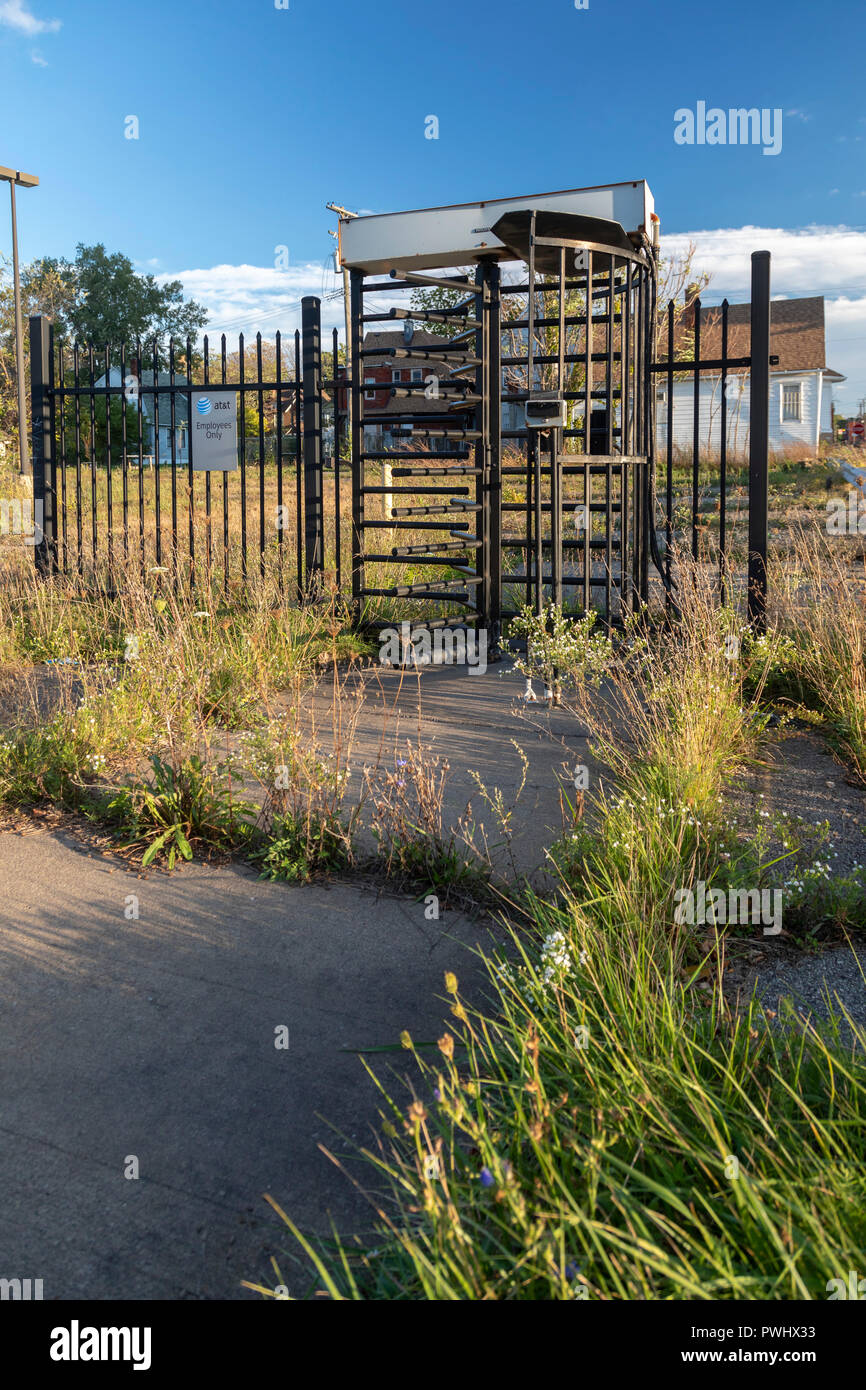 Detroit, Michigan - A turnstile is all that remains on an abandoned AT&T employee parking lot. Stock Photo