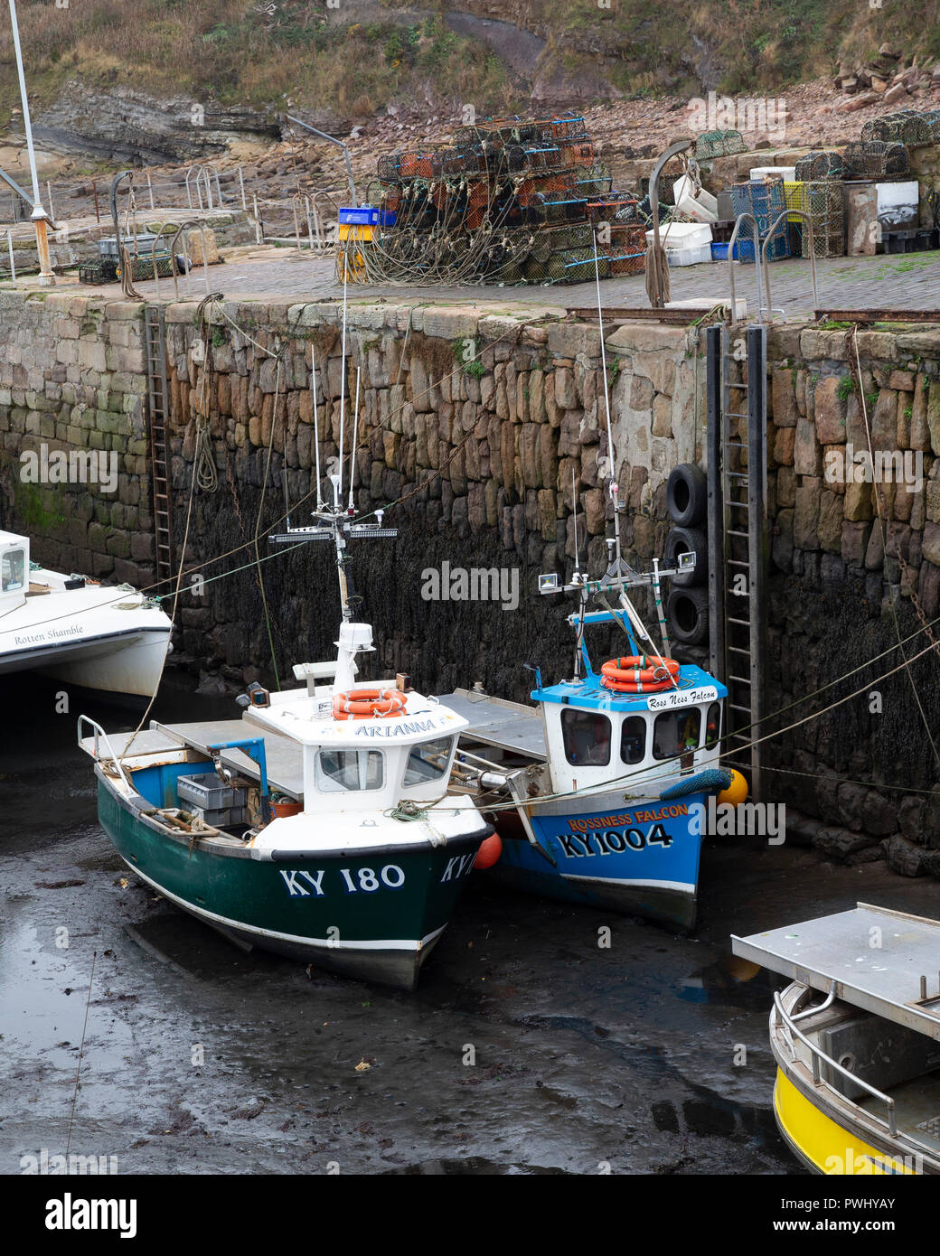Inshore fishing boats in Crail Harbour at low tide Stock Photo - Alamy