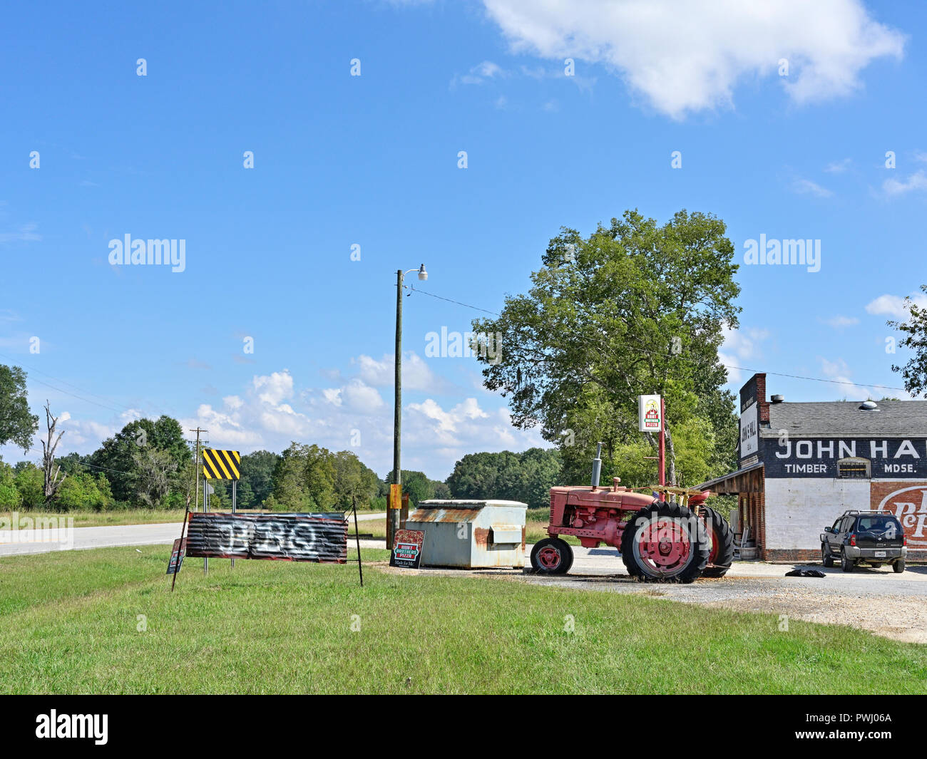 Rural Alabama BBQ or Bar-B-Que restaurant or roadside store with homemade sign by the country road in Cecil Alabama, USA. Stock Photo