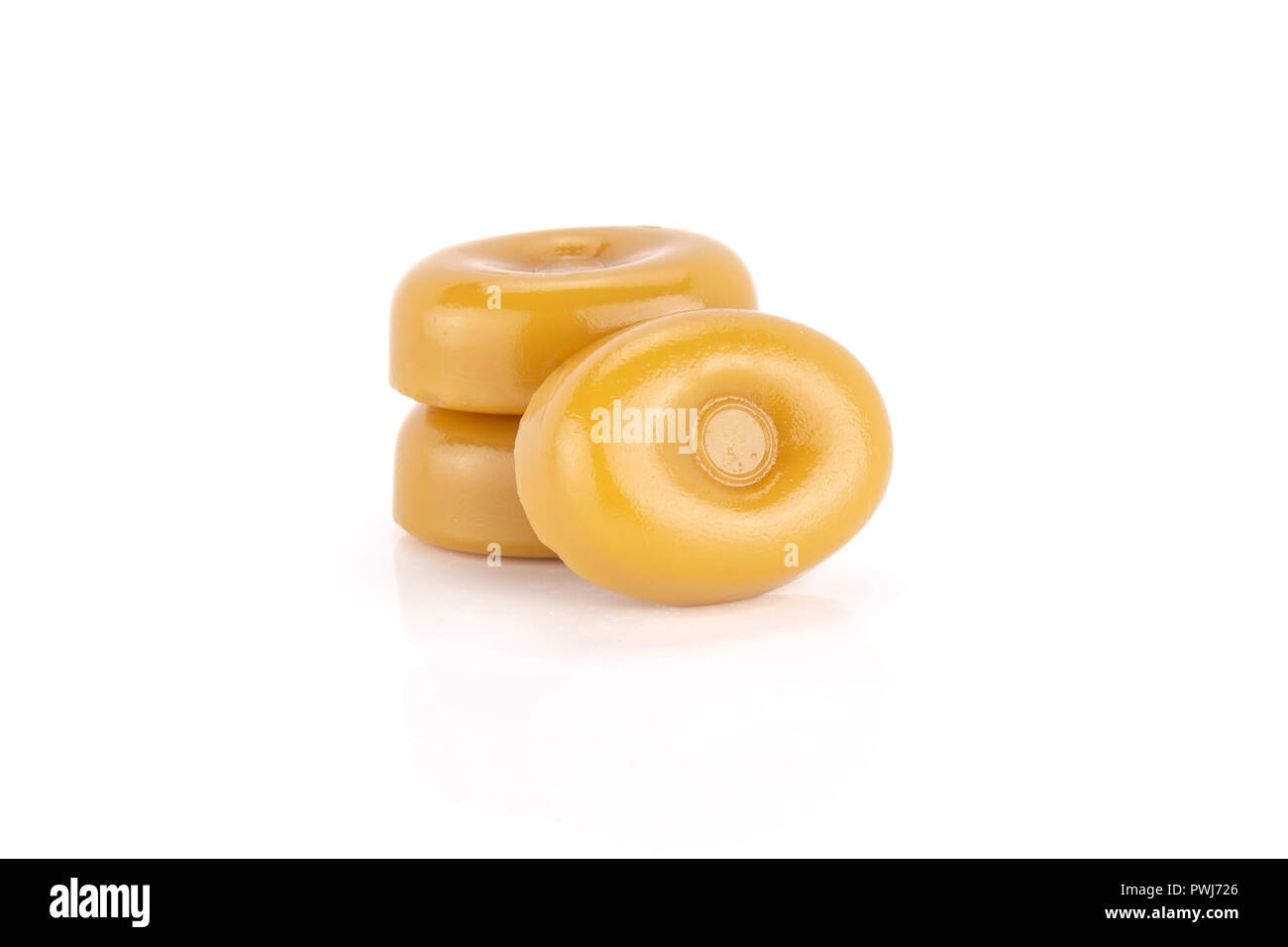 Group of three whole hard caramel cream candy butterscotch variety