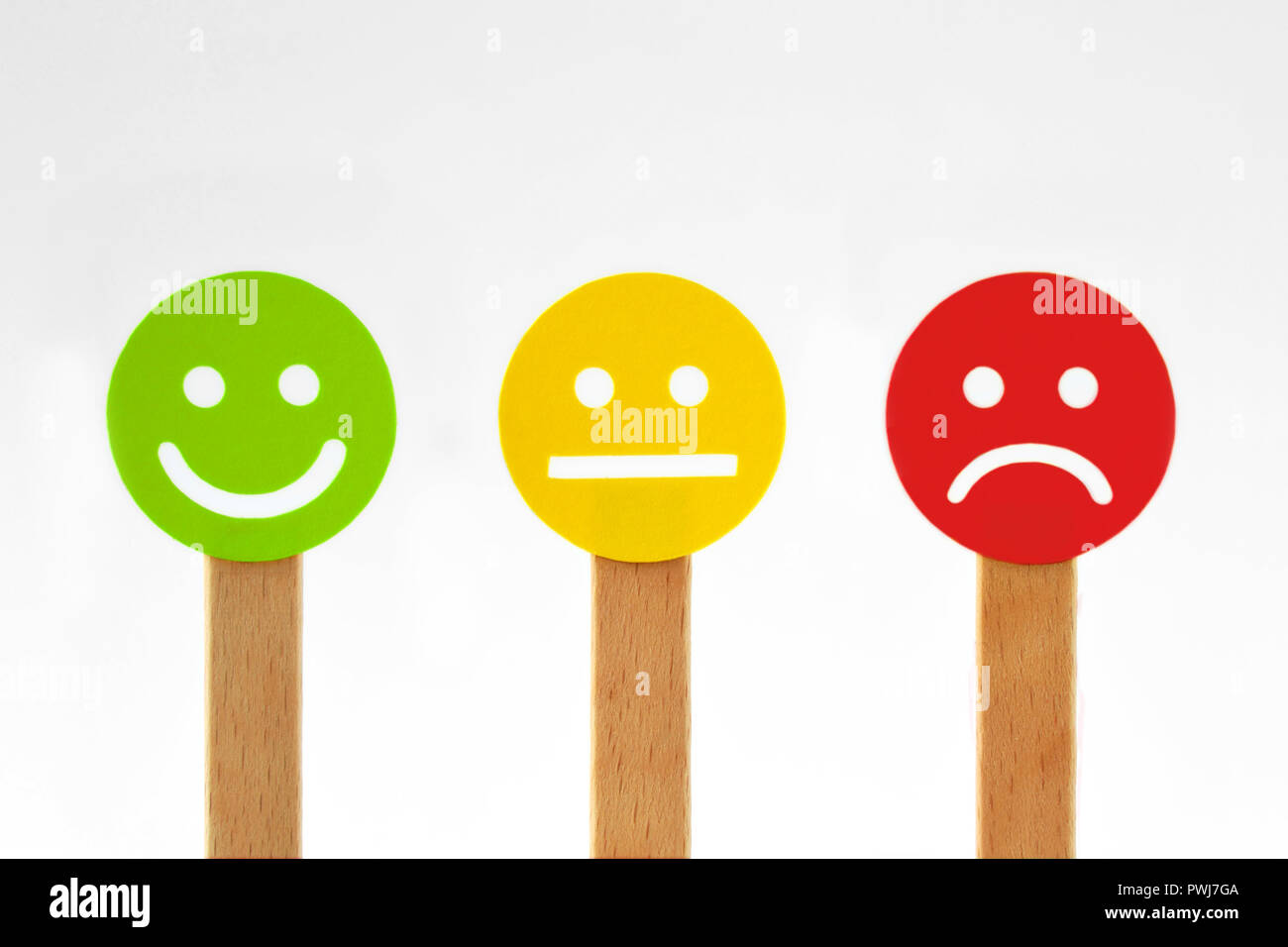 Green, yellow and red smiley faces with positive, neutral and negative expression Stock Photo