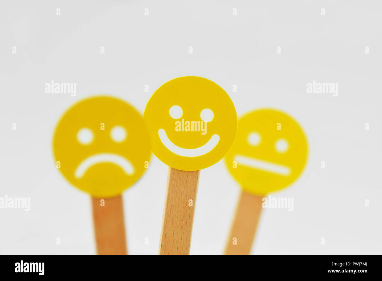 Yellow smiley faces with positive, neutral and negative expression - Positivity concept Stock Photo