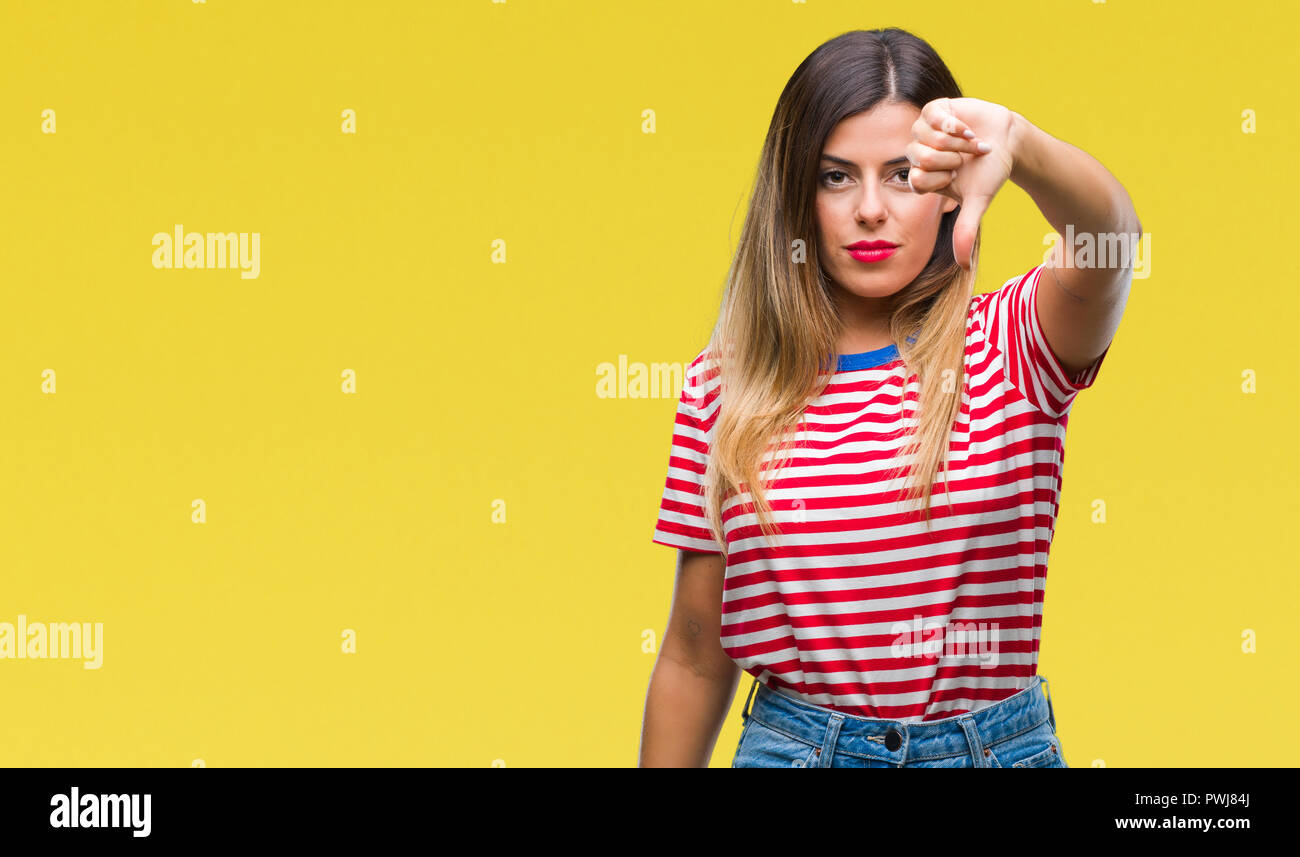 Young beautiful woman casual look over isolated background looking ...