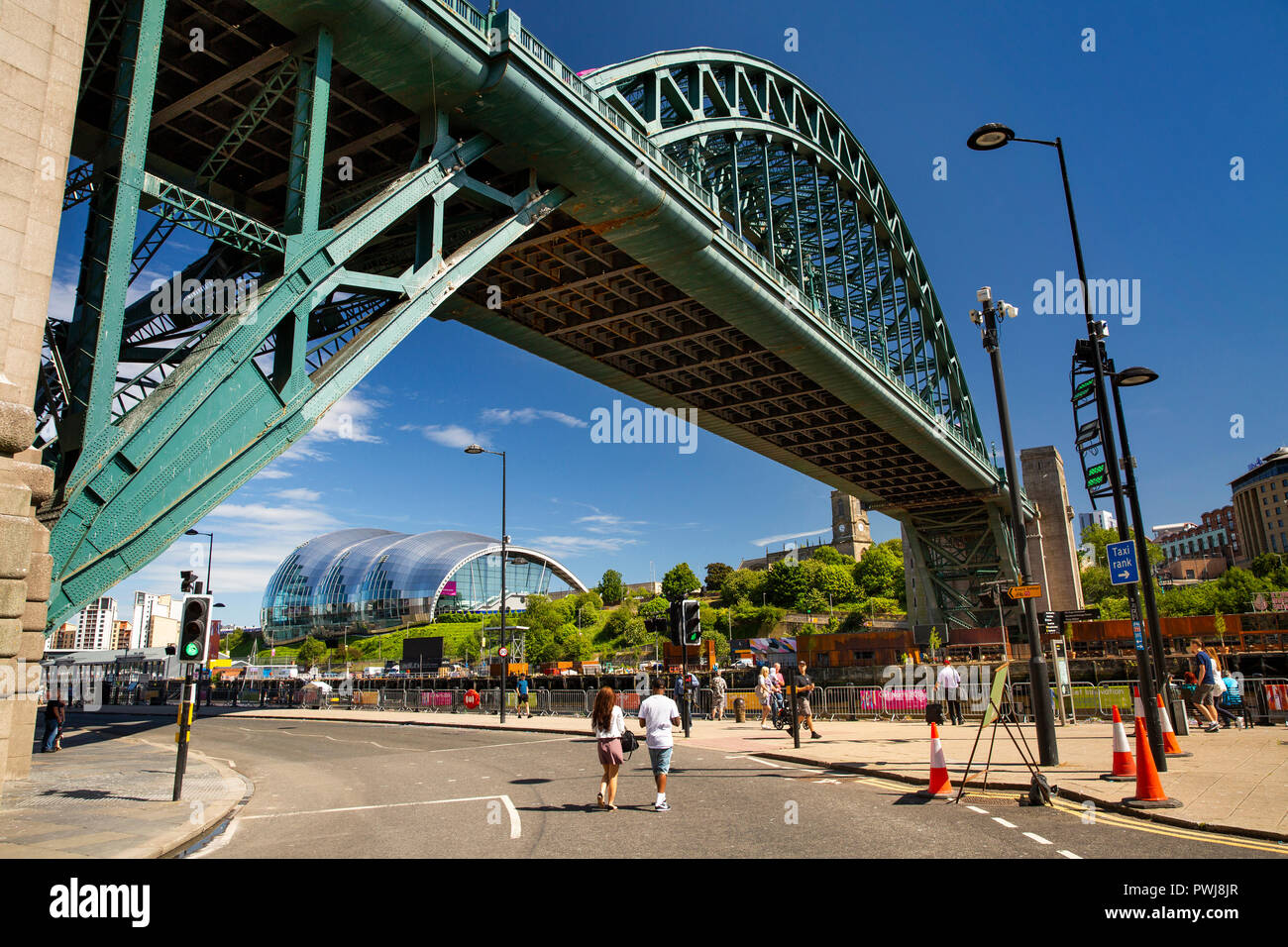 UK, England, Tyneside, Newcastle upon Tyne, Tyne Bridge and Gateshead Sage Centre from River Tyne Quayside Stock Photo