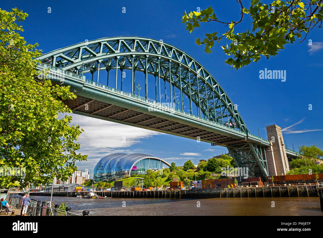 UK, England, Tyneside, Newcastle upon Tyne, Tyne Bridge and Gateshead Sage Centre from River Tyne Quayside Stock Photo