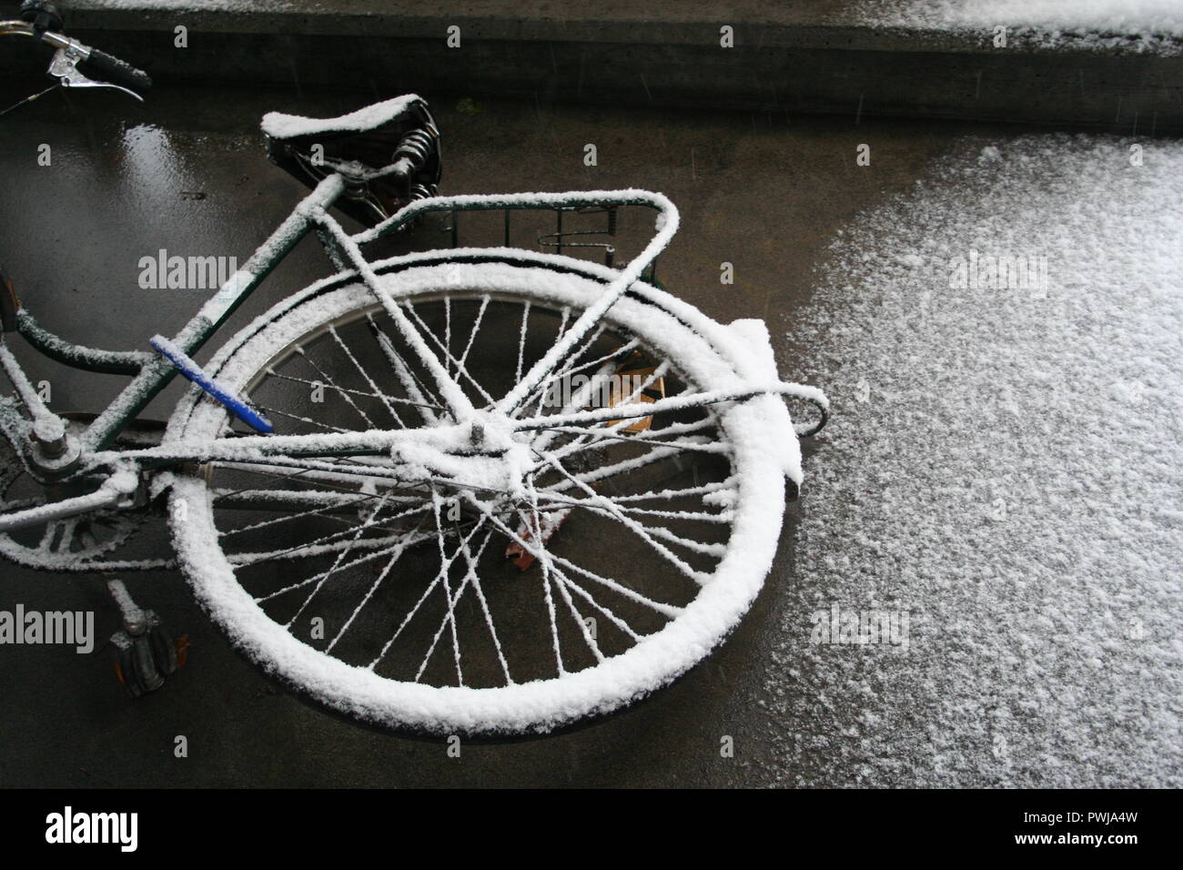 Winter in Switzerland, snow on a bike. Stock Photo