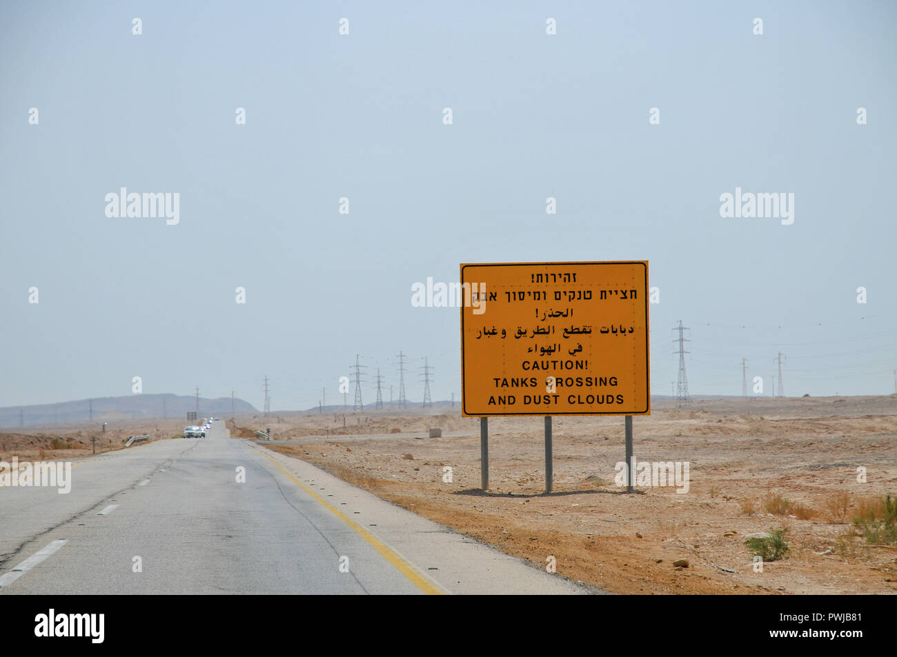 Warning sign in Hebrew, Arabic and English Caution! Tanks crossing and