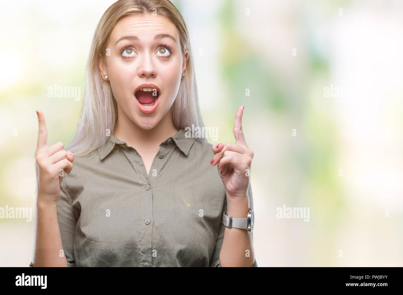 Young blonde business woman over isolated background amazed and ...