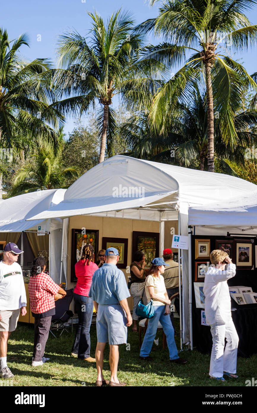 Miami Florida,Coral Gables,University of Miami,Beaux Arts Festival of Art,juried show,community men,women,tent,looking,browsing,shopping shopper shopp Stock Photo