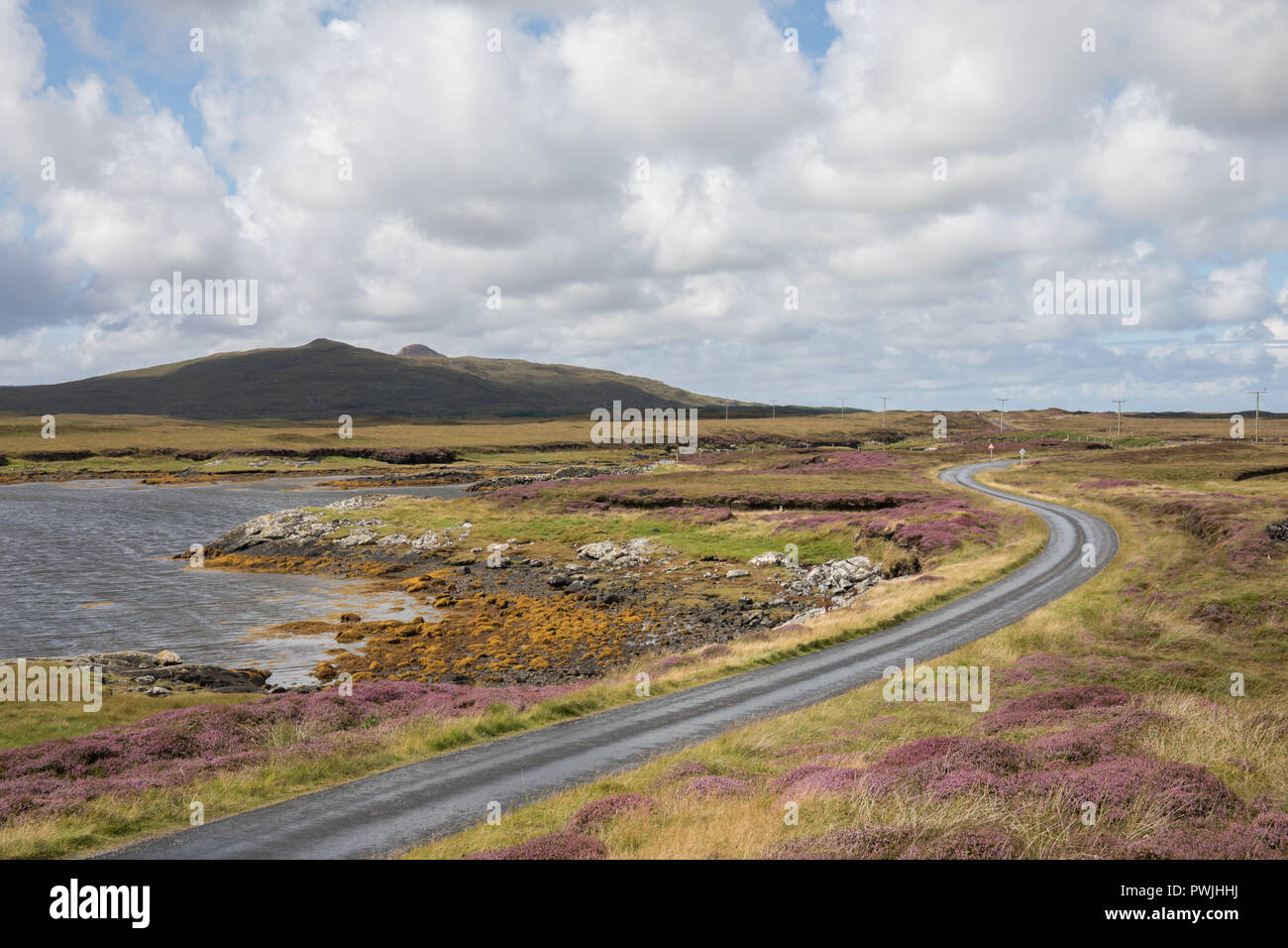Single track road on North Uist, Outer Hebrides, Scotland Stock Photo