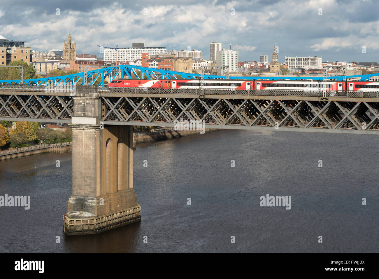 LNER express passenger train crossing the King Edward Bridge over the river Tyne, Newcastle upon Tyne, England, UK Stock Photo