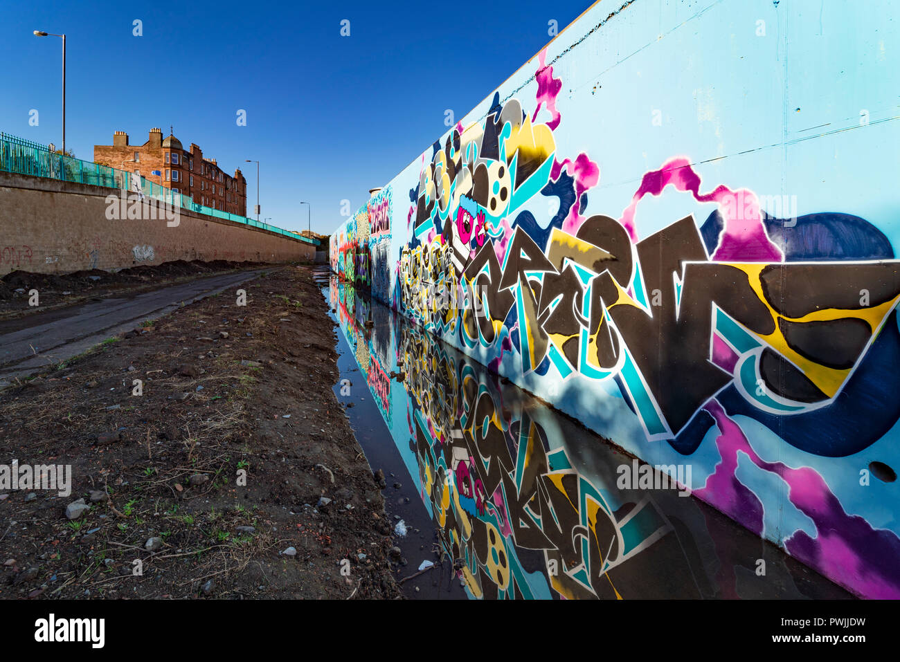 View of murals painted on wall at Marine Parade Graffiti Wall in Leith , Scotland, Stock Photo