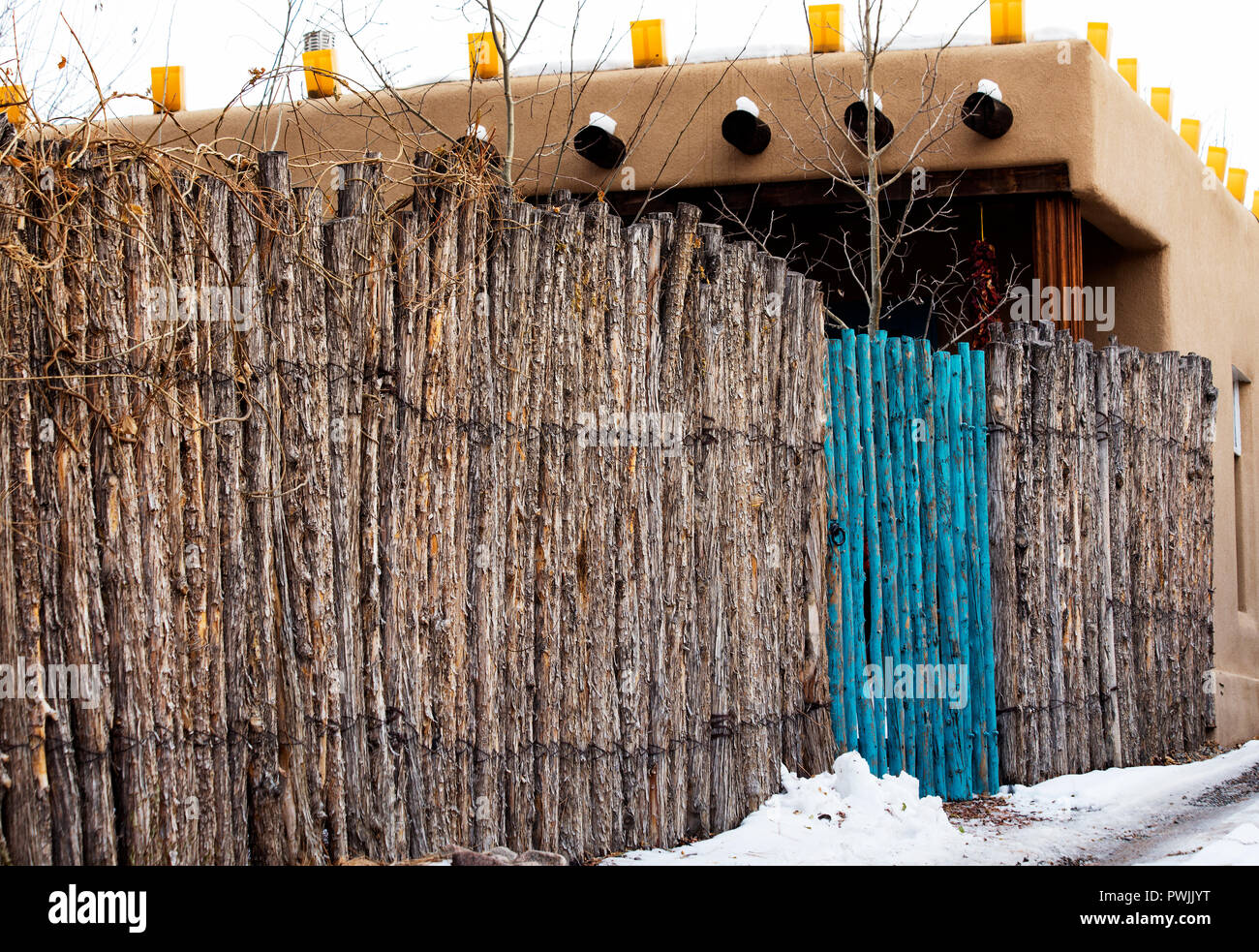 Blue Gate and Luminaries in Santa Fe, New Mexico Stock Photo