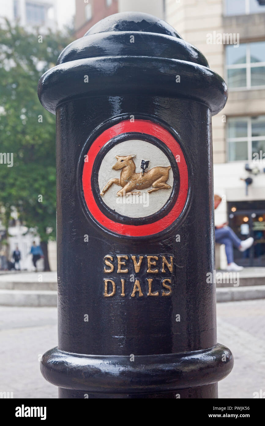 London, Covent Garden.   A bollard with its own distinctive emblem at the celebrated Seven Dials road junction. Stock Photo