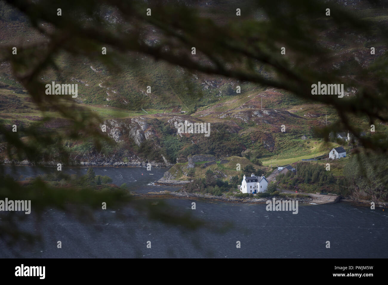 House on the side of a windswept Loch Carron Stock Photo Alamy