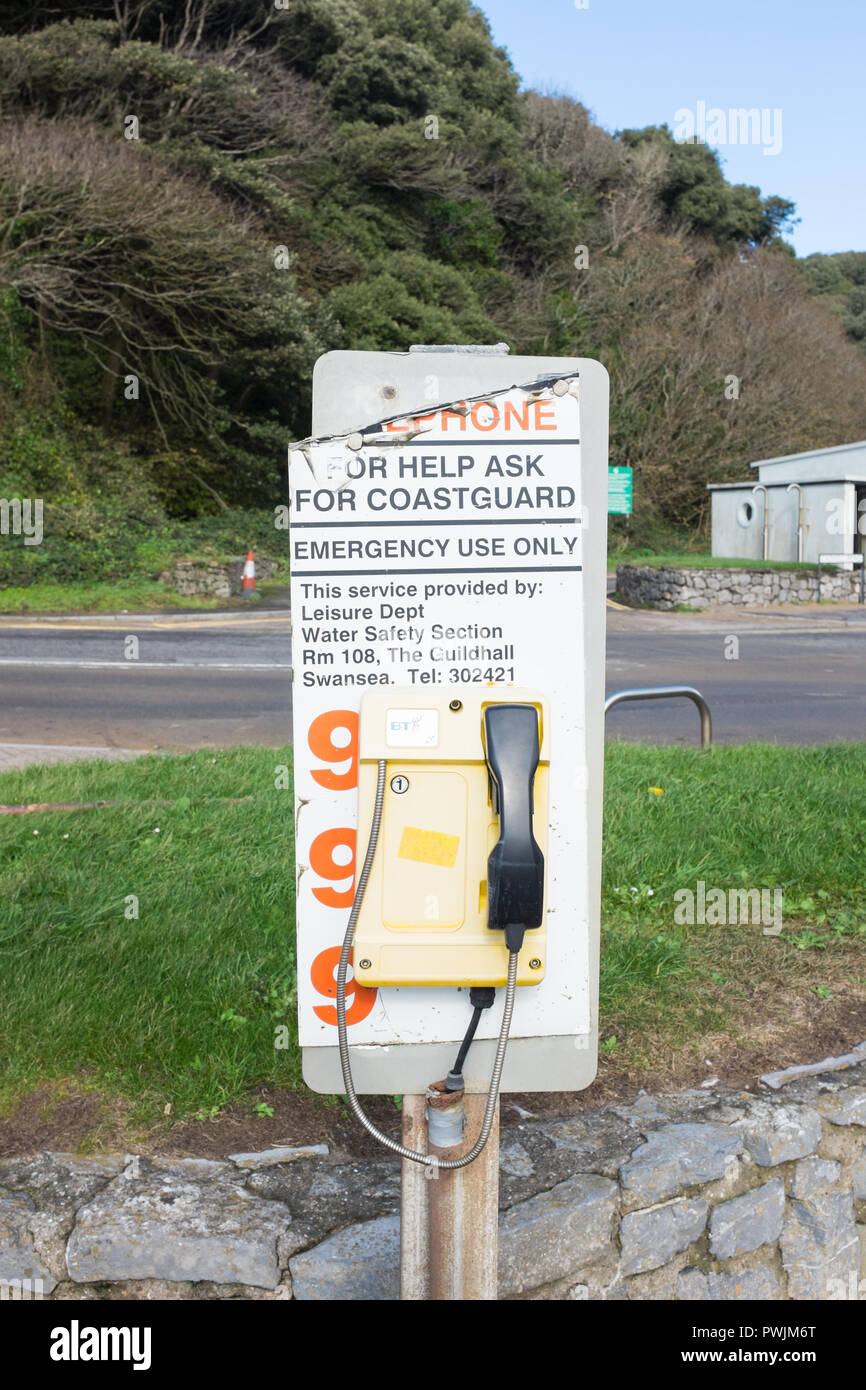 Emergency telephone to contact the Coastguard at Caswell Beach, The Mumbles, Swansea Stock Photo