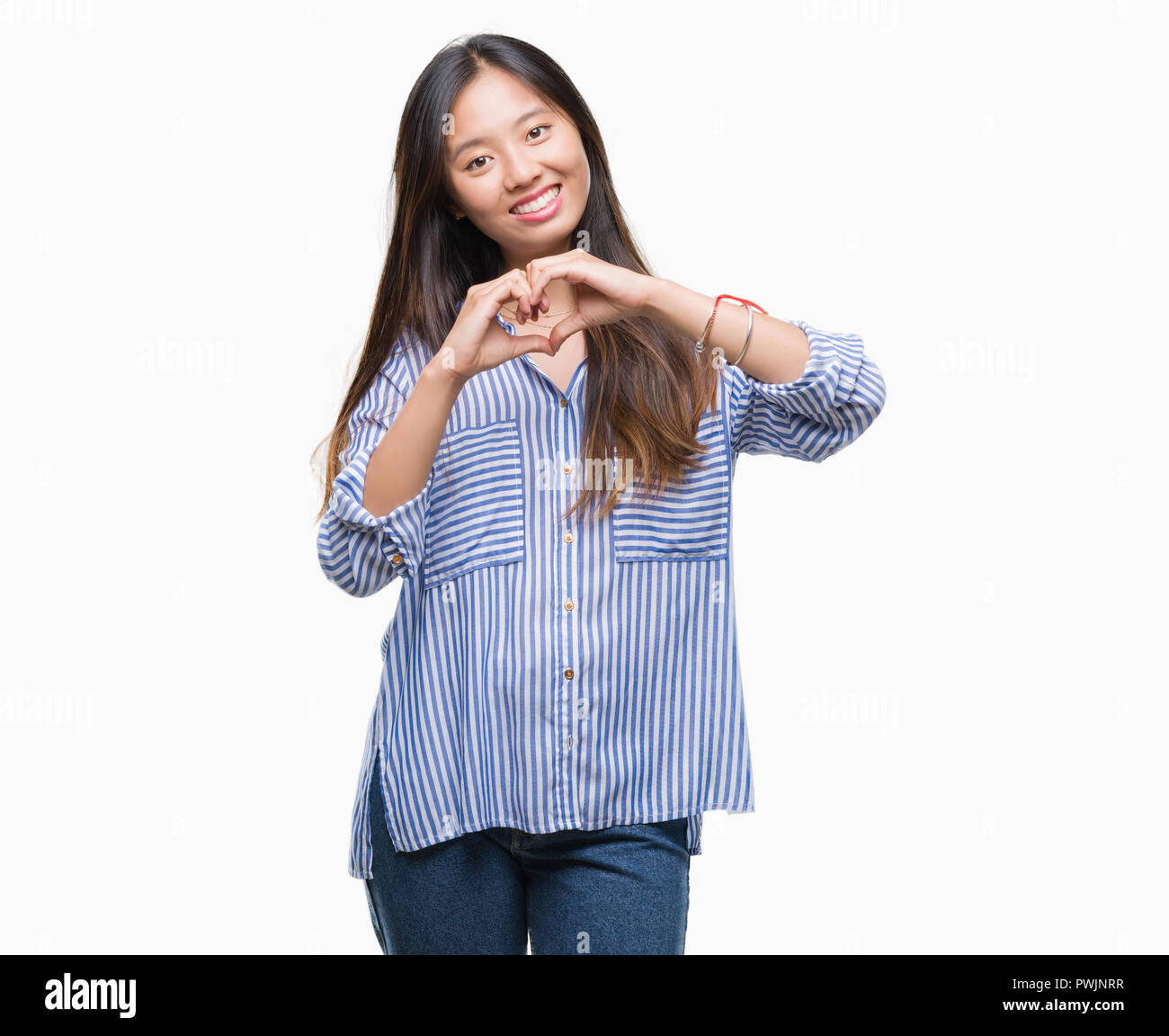 Young asian woman over isolated background smiling in love showing ...