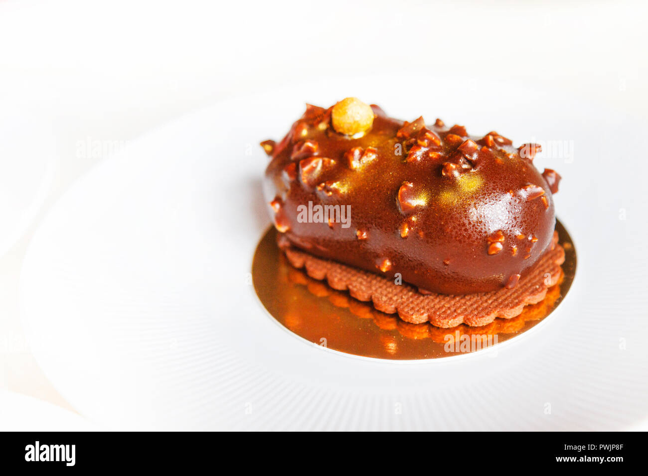 Modern Pink Cake With Chocolate Decor Caramel French Macaroons Meringues  And Waffle Paper White Background Stock Photo - Download Image Now - iStock