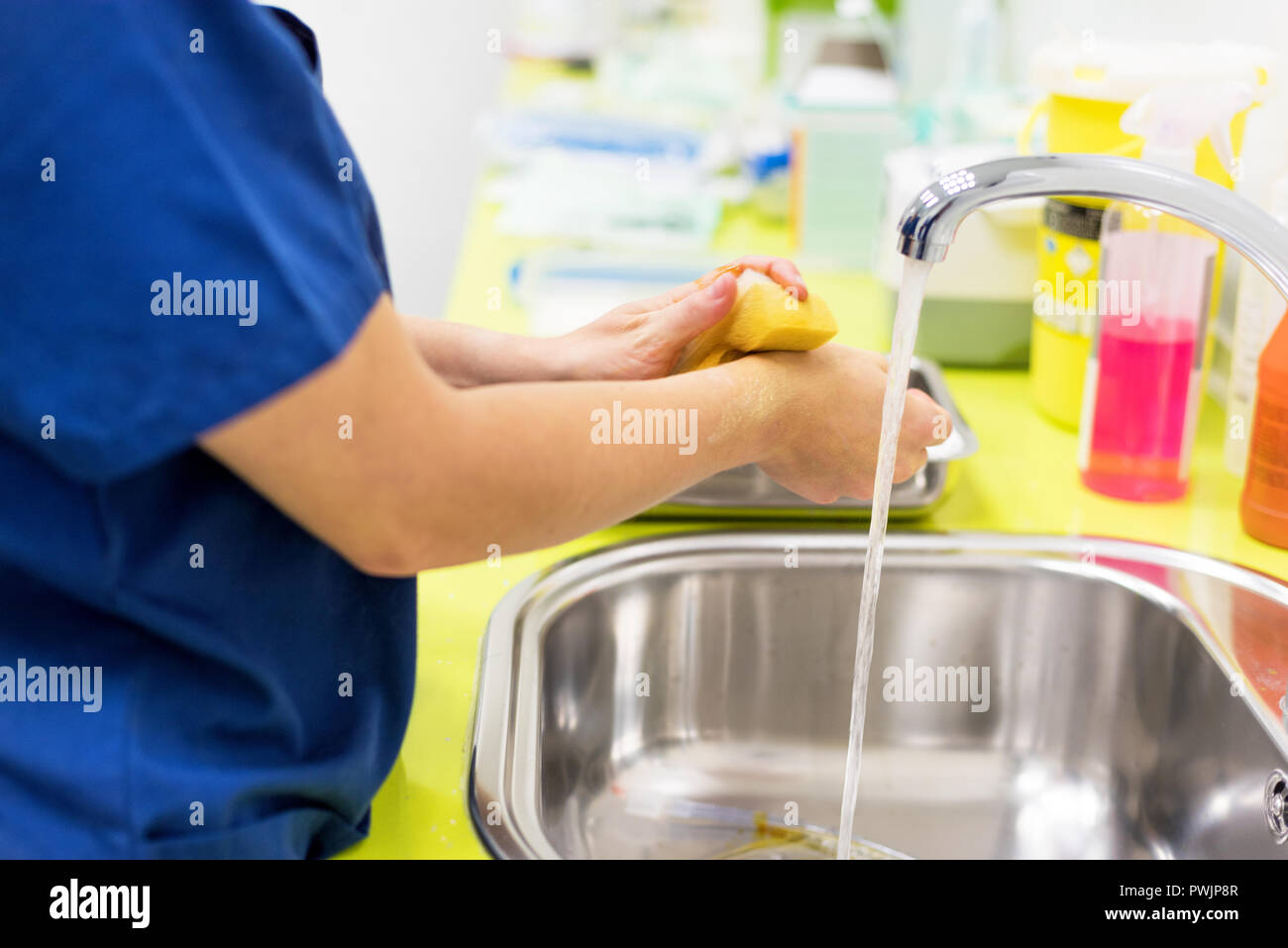Surgeon washing hands before surgery hires stock photography and